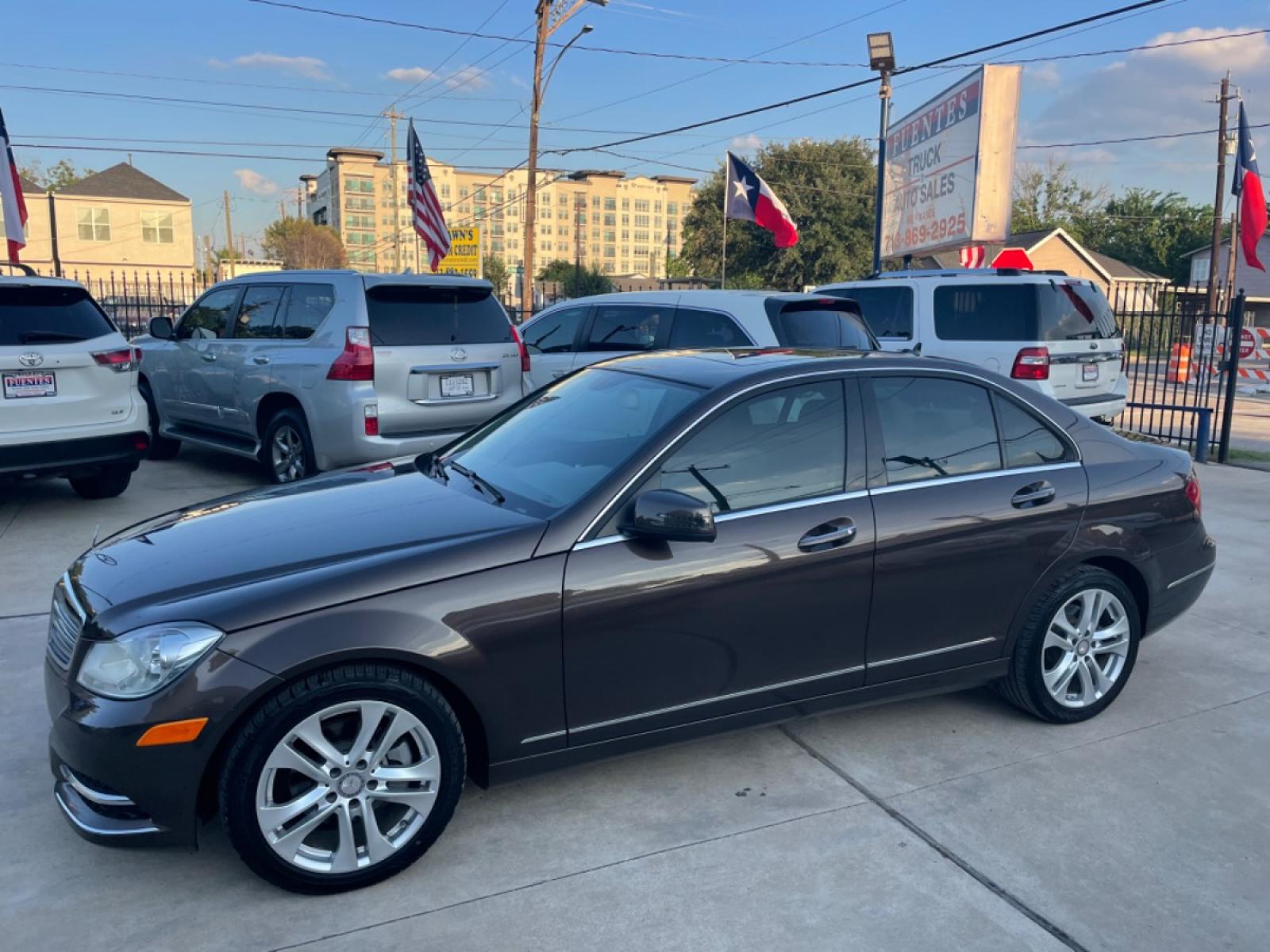2013 Brown /Beige Mercedes-Benz C-Class C250 Sport Sedan (WDDGF4HBXDR) with an 3.0L V6 DOHC 16V engine, 7-Speed Automatic transmission, located at 1501 West 15th St., Houston, 77008, (713) 869-2925, 29.797941, -95.411789 - Photo #0