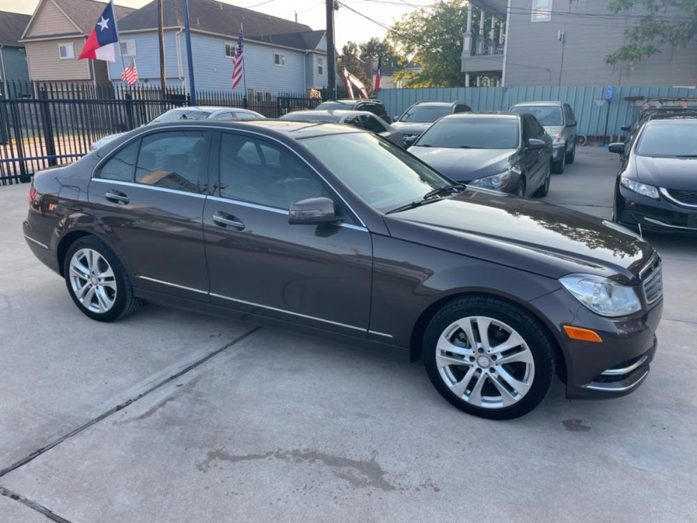 2013 Brown /Beige Mercedes-Benz C-Class C250 Sport Sedan (WDDGF4HBXDR) with an 3.0L V6 DOHC 16V engine, 7-Speed Automatic transmission, located at 1501 West 15th St., Houston, 77008, (713) 869-2925, 29.797941, -95.411789 - Photo #1