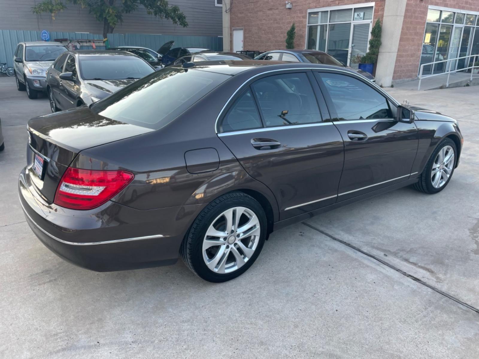 2013 Brown /Beige Mercedes-Benz C-Class C250 Sport Sedan (WDDGF4HBXDR) with an 3.0L V6 DOHC 16V engine, 7-Speed Automatic transmission, located at 1501 West 15th St., Houston, 77008, (713) 869-2925, 29.797941, -95.411789 - Photo #2
