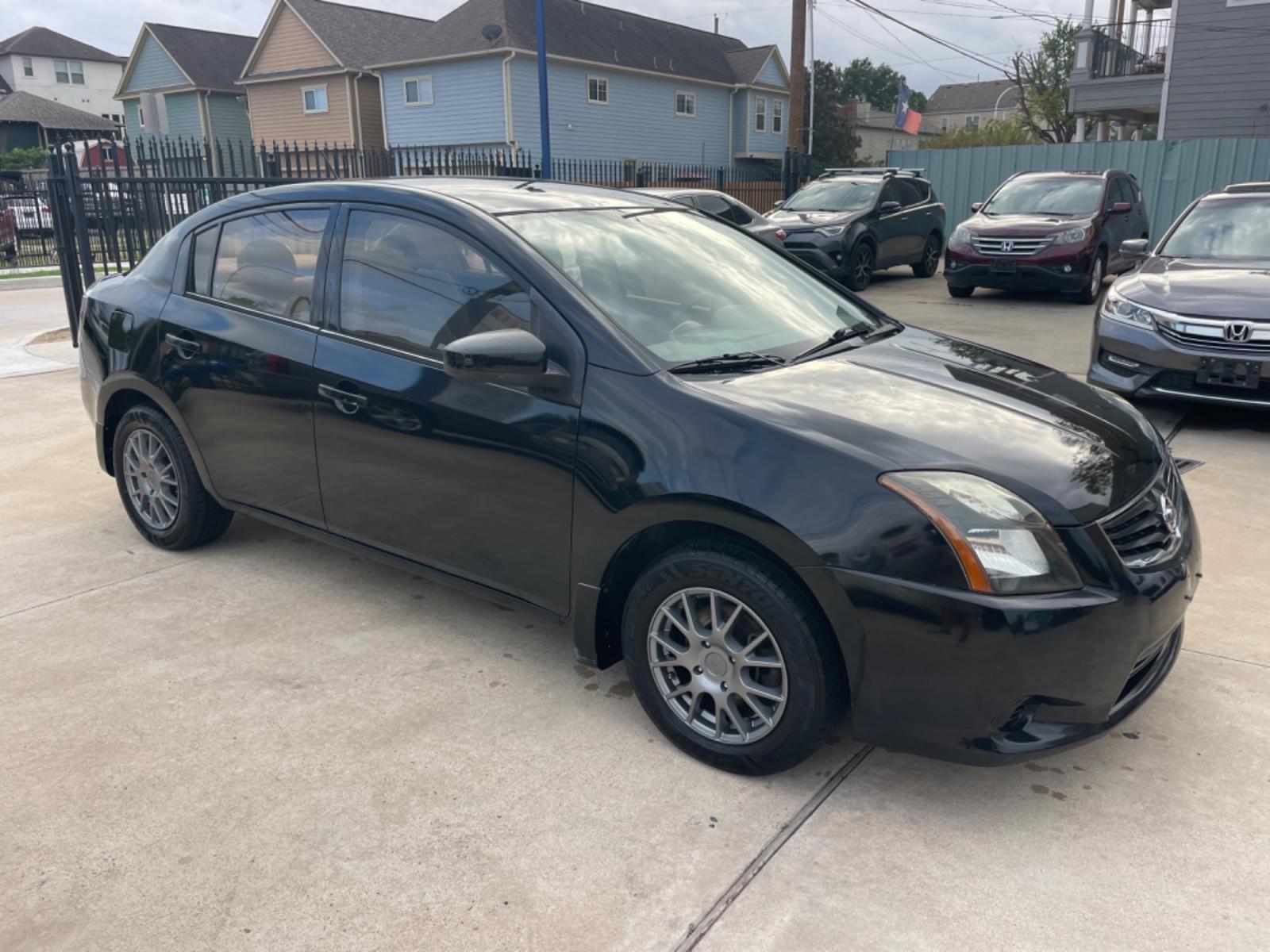 2010 Black /Beige Nissan Sentra 2.0 (3N1AB6AP7AL) with an 2.0L L4 DOHC 16V engine, Continuously Variable Transmisson transmission, located at 1501 West 15th St., Houston, 77008, (713) 869-2925, 29.797941, -95.411789 - Photo #1