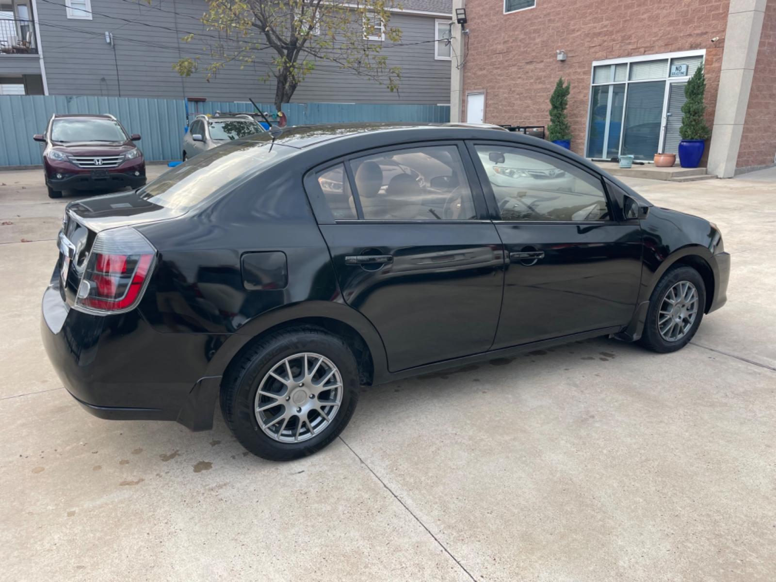2010 Black /Beige Nissan Sentra 2.0 (3N1AB6AP7AL) with an 2.0L L4 DOHC 16V engine, Continuously Variable Transmisson transmission, located at 1501 West 15th St., Houston, 77008, (713) 869-2925, 29.797941, -95.411789 - Photo #2