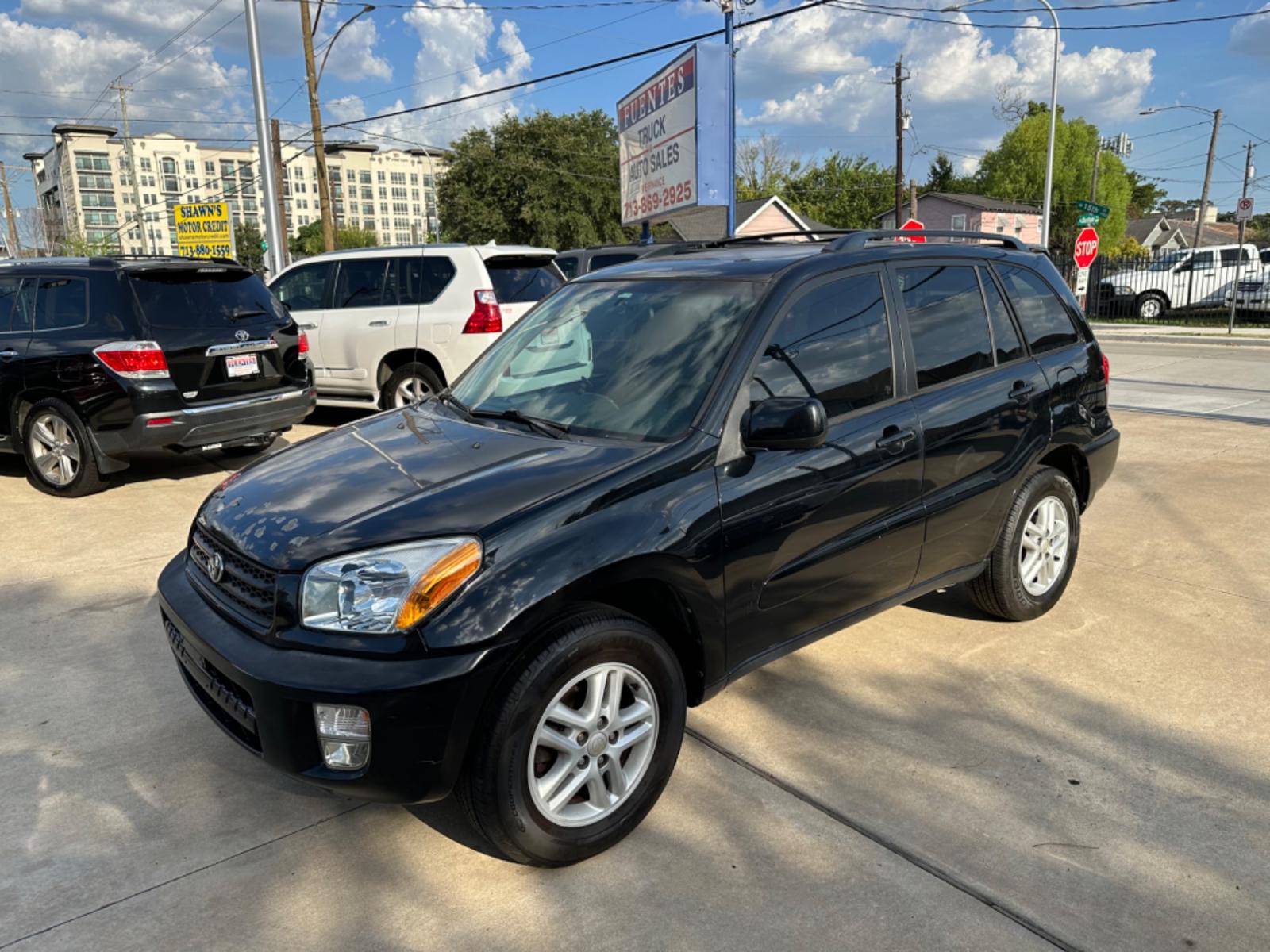 2002 Black /Gray Toyota RAV4 2WD (JTEGH20V720) with an 2.0L L4 DOHC 16V engine, AUTOMATIC transmission, located at 1501 West 15th St., Houston, 77008, (713) 869-2925, 29.797941, -95.411789 - Photo #0