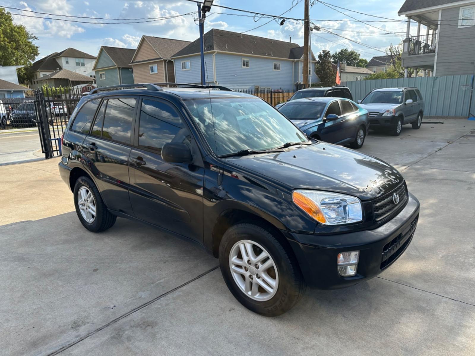 2002 Black /Gray Toyota RAV4 2WD (JTEGH20V720) with an 2.0L L4 DOHC 16V engine, AUTOMATIC transmission, located at 1501 West 15th St., Houston, 77008, (713) 869-2925, 29.797941, -95.411789 - Photo #1