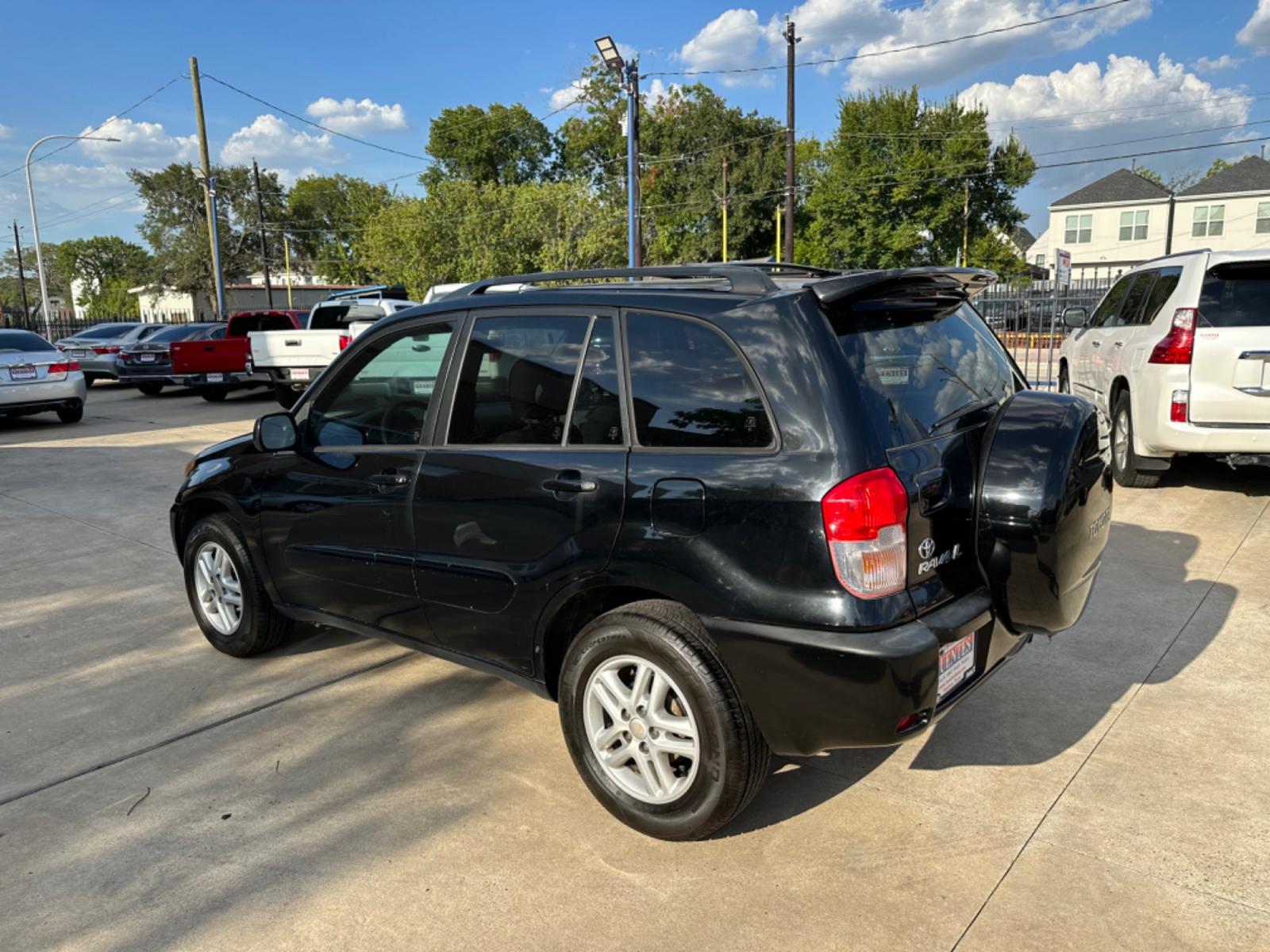 2002 Black /Gray Toyota RAV4 2WD (JTEGH20V720) with an 2.0L L4 DOHC 16V engine, AUTOMATIC transmission, located at 1501 West 15th St., Houston, 77008, (713) 869-2925, 29.797941, -95.411789 - Photo #3