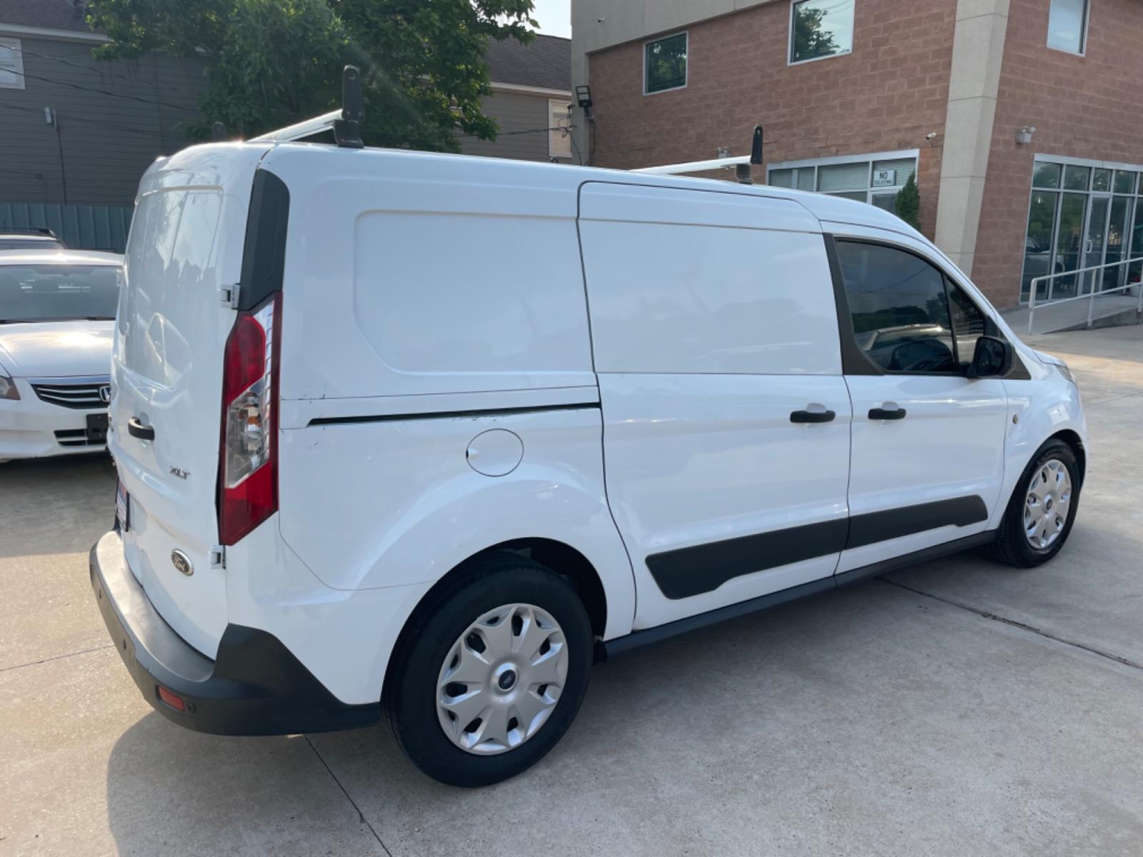 2014 White /Black Ford Transit Connect XLT LWB (NM0LS7F75E1) with an 2.5L L4 DOHC 16V engine, 6-Speed Automatic transmission, located at 1501 West 15th St., Houston, 77008, (713) 869-2925, 29.797941, -95.411789 - Photo #2