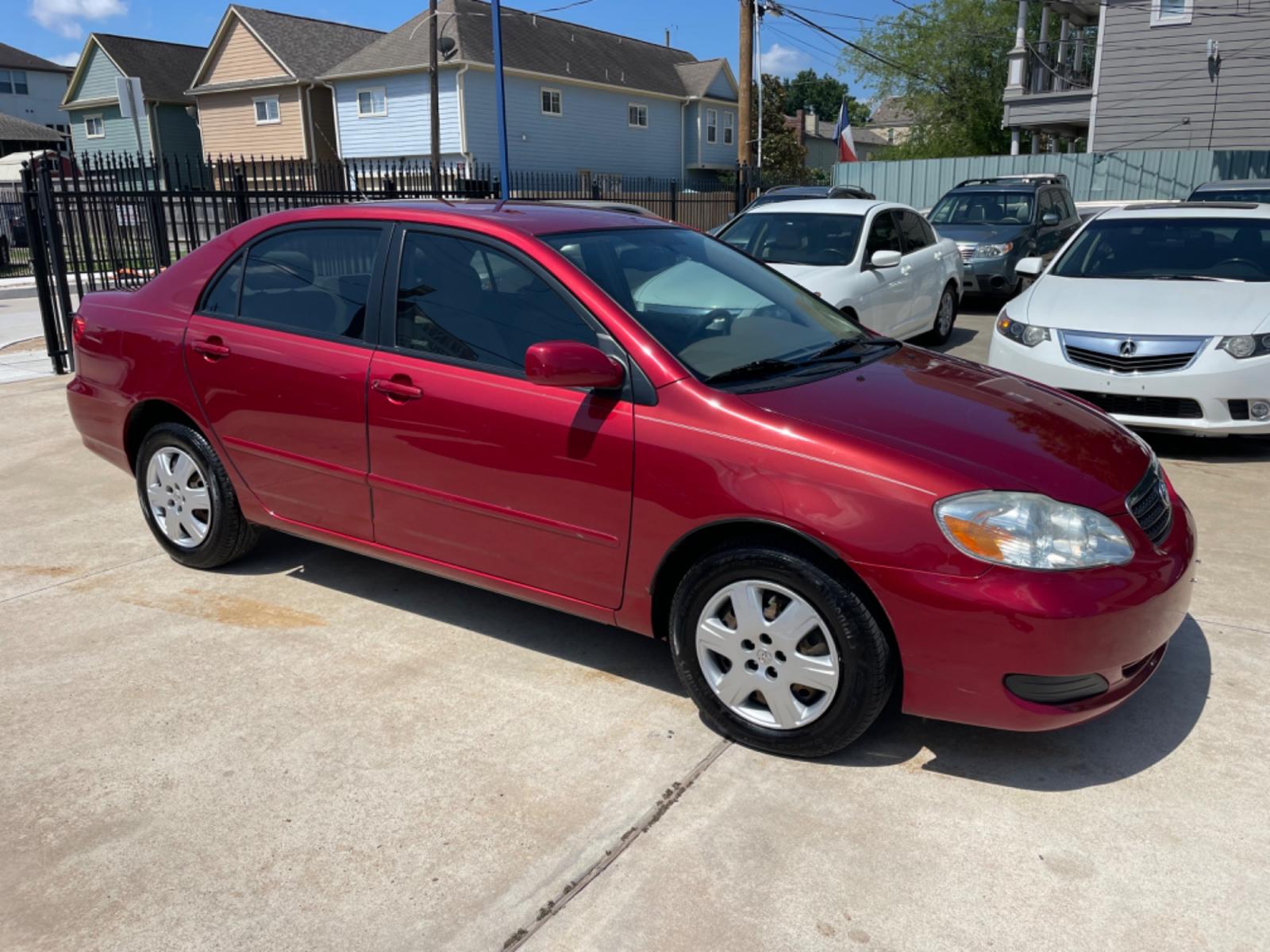 2006 Red /Beige Toyota Corolla LE (1NXBR32E86Z) with an 1.8L L4 DOHC 16V engine, Automatic transmission, located at 1501 West 15th St., Houston, 77008, (713) 869-2925, 29.797941, -95.411789 - Photo #1
