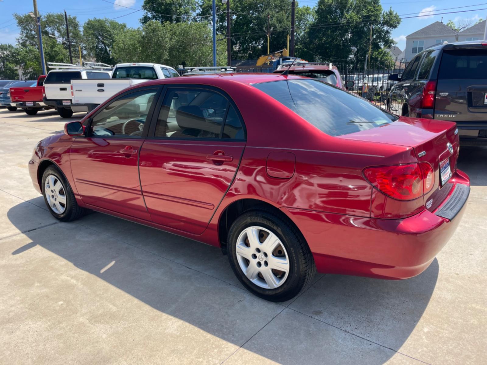 2006 Red /Beige Toyota Corolla LE (1NXBR32E86Z) with an 1.8L L4 DOHC 16V engine, Automatic transmission, located at 1501 West 15th St., Houston, 77008, (713) 869-2925, 29.797941, -95.411789 - Photo #3