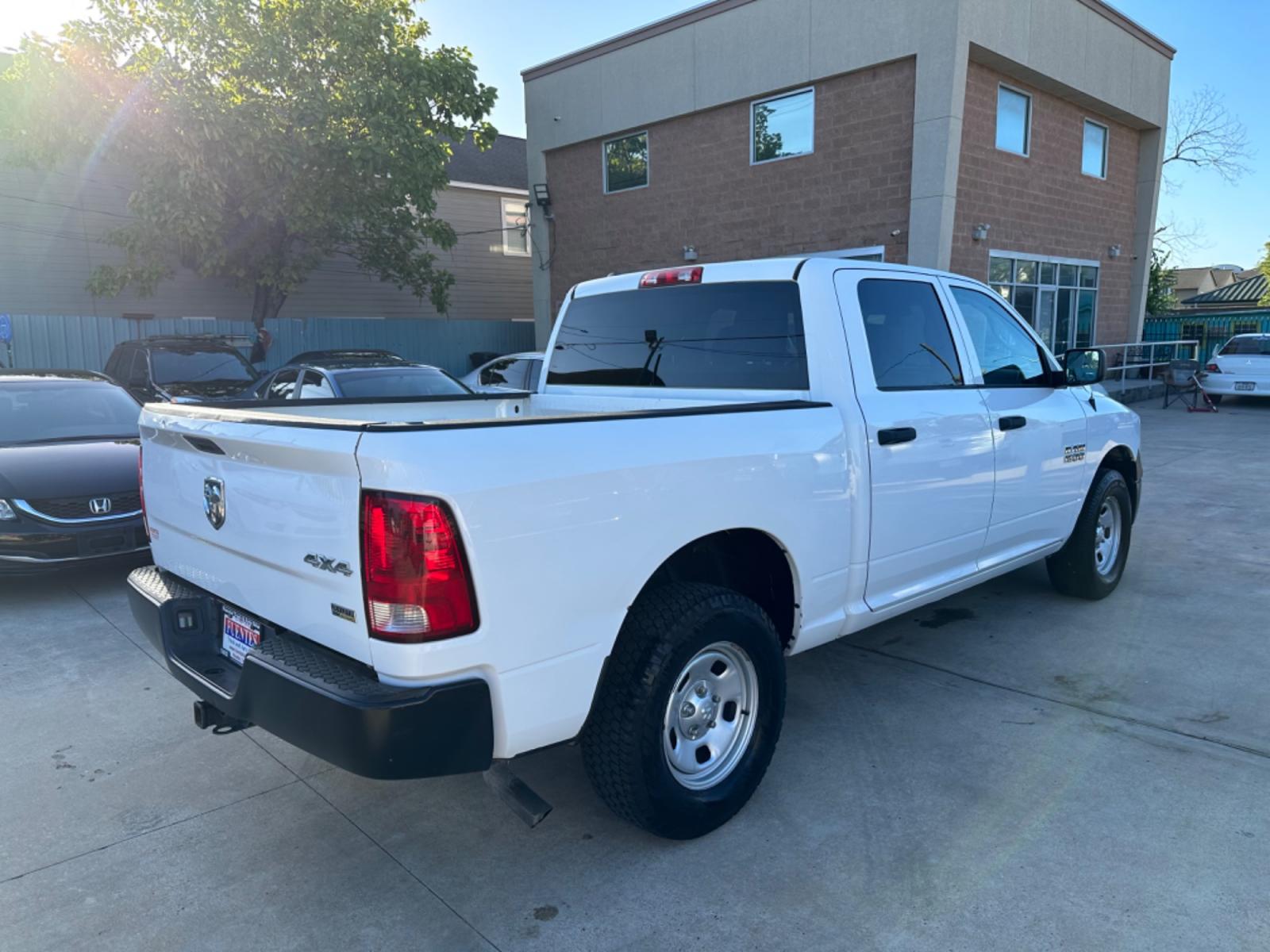 2014 White /Silver RAM 1500 Tradesman Crew Cab SWB 4WD (1C6RR7KG8ES) with an 3.6L V6 DOHC 24V FFV engine, 6-Speed Automatic transmission, located at 1501 West 15th St., Houston, 77008, (713) 869-2925, 29.797941, -95.411789 - Photo #2