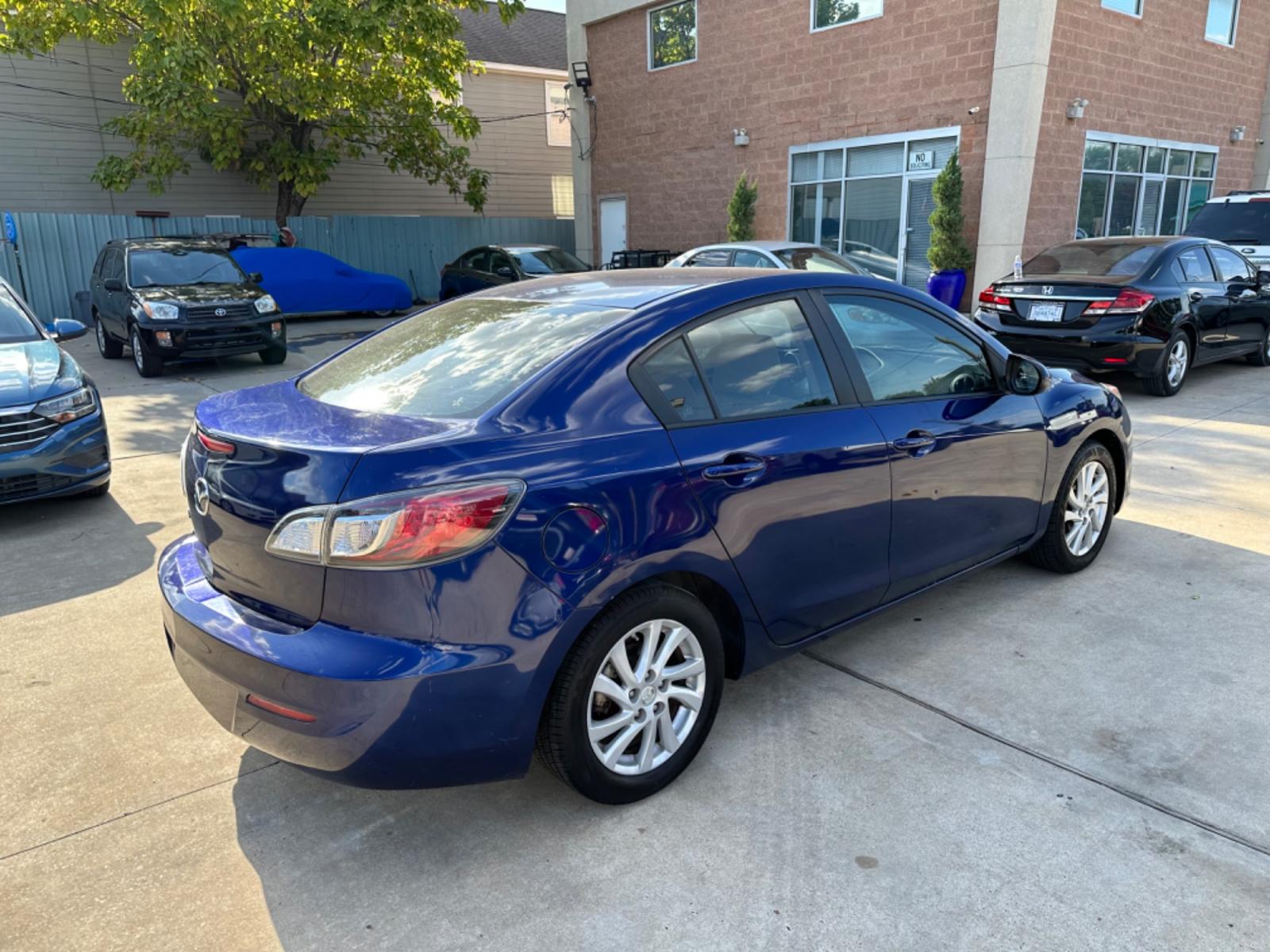 2012 Blue /Beige Mazda MAZDA3 i Touring 4-Door (JM1BL1VF1C1) with an 2.0L L4 DOHC 16V engine, Auto transmission, located at 1501 West 15th St., Houston, 77008, (713) 869-2925, 29.797941, -95.411789 - Photo #2