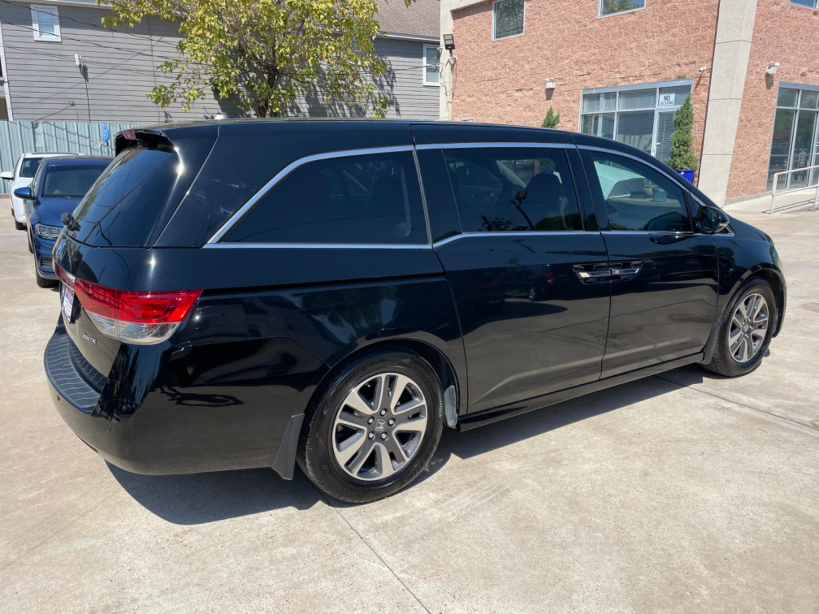 2015 Black /Gray Honda Odyssey Touring (5FNRL5H96FB) with an 3.5L V6 SOHC 24V engine, 6-Speed Automatic transmission, located at 1501 West 15th St., Houston, 77008, (713) 869-2925, 29.797941, -95.411789 - Photo #3