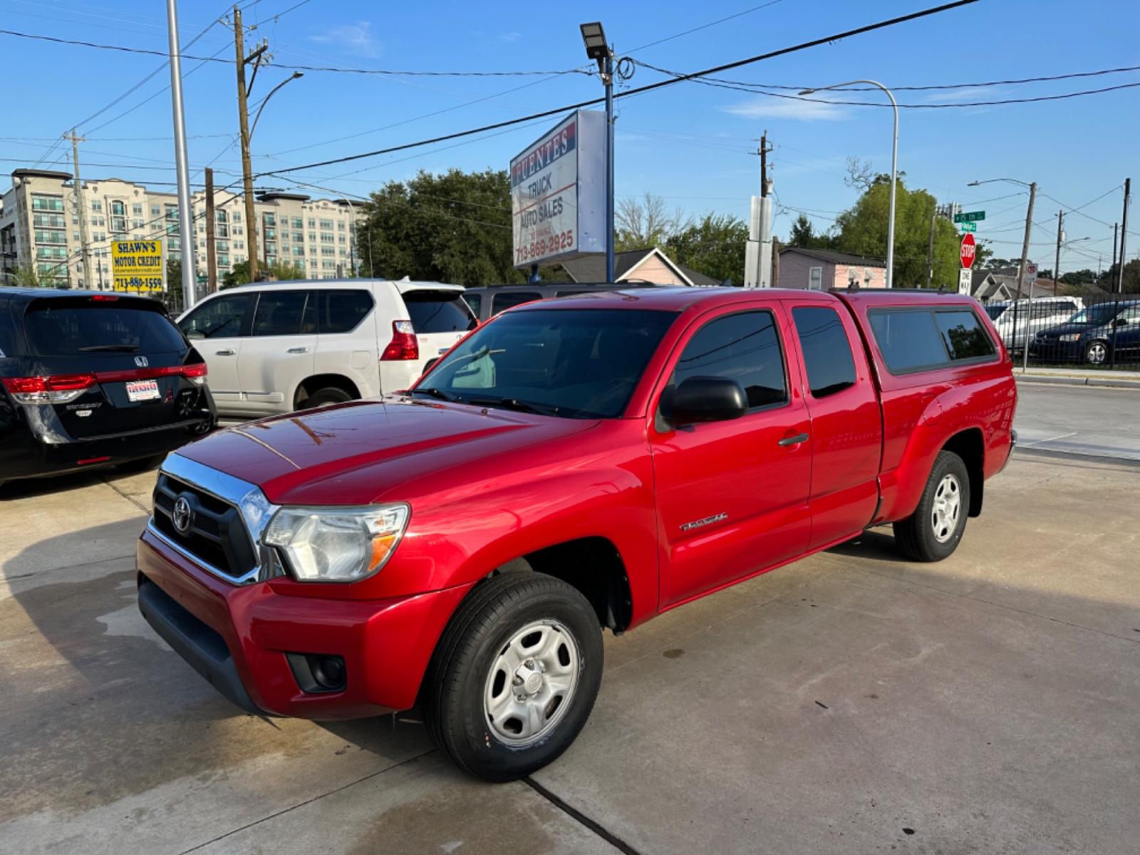 2014 Red /Silver Toyota Tacoma Access Cab I4 4AT 2WD (5TFTX4CN8EX) with an 2.7L L4 DOHC 16V engine, 4-Speed Automatic transmission, located at 1501 West 15th St., Houston, 77008, (713) 869-2925, 29.797941, -95.411789 - Photo #0