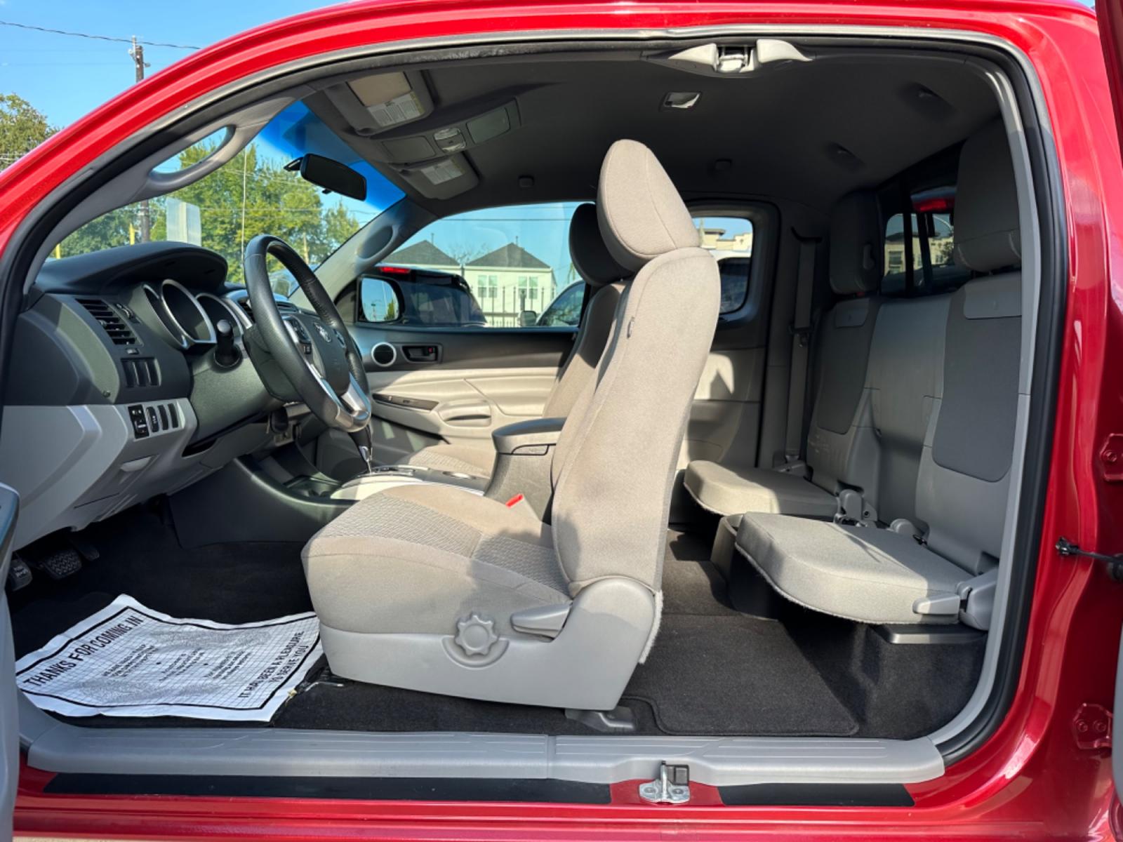 2014 Red /Silver Toyota Tacoma Access Cab I4 4AT 2WD (5TFTX4CN8EX) with an 2.7L L4 DOHC 16V engine, 4-Speed Automatic transmission, located at 1501 West 15th St., Houston, 77008, (713) 869-2925, 29.797941, -95.411789 - Photo #7