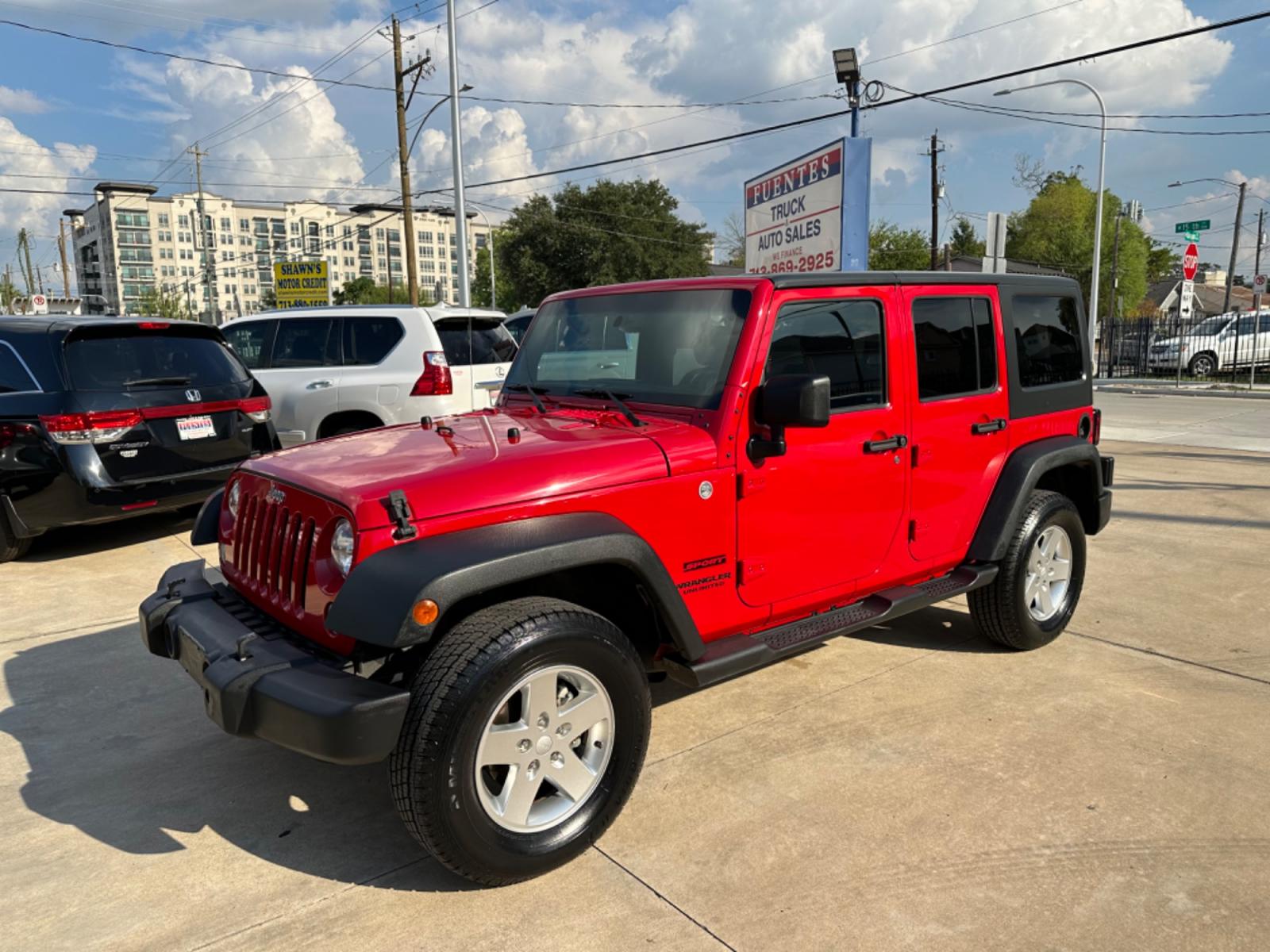 2014 Red /Black Jeep Wrangler Unlimited Sport 4WD (1C4HJWDG7EL) with an 3.6L V6 DOHC 24V FFV engine, Automatic transmission, located at 1501 West 15th St., Houston, 77008, (713) 869-2925, 29.797941, -95.411789 - Photo #0