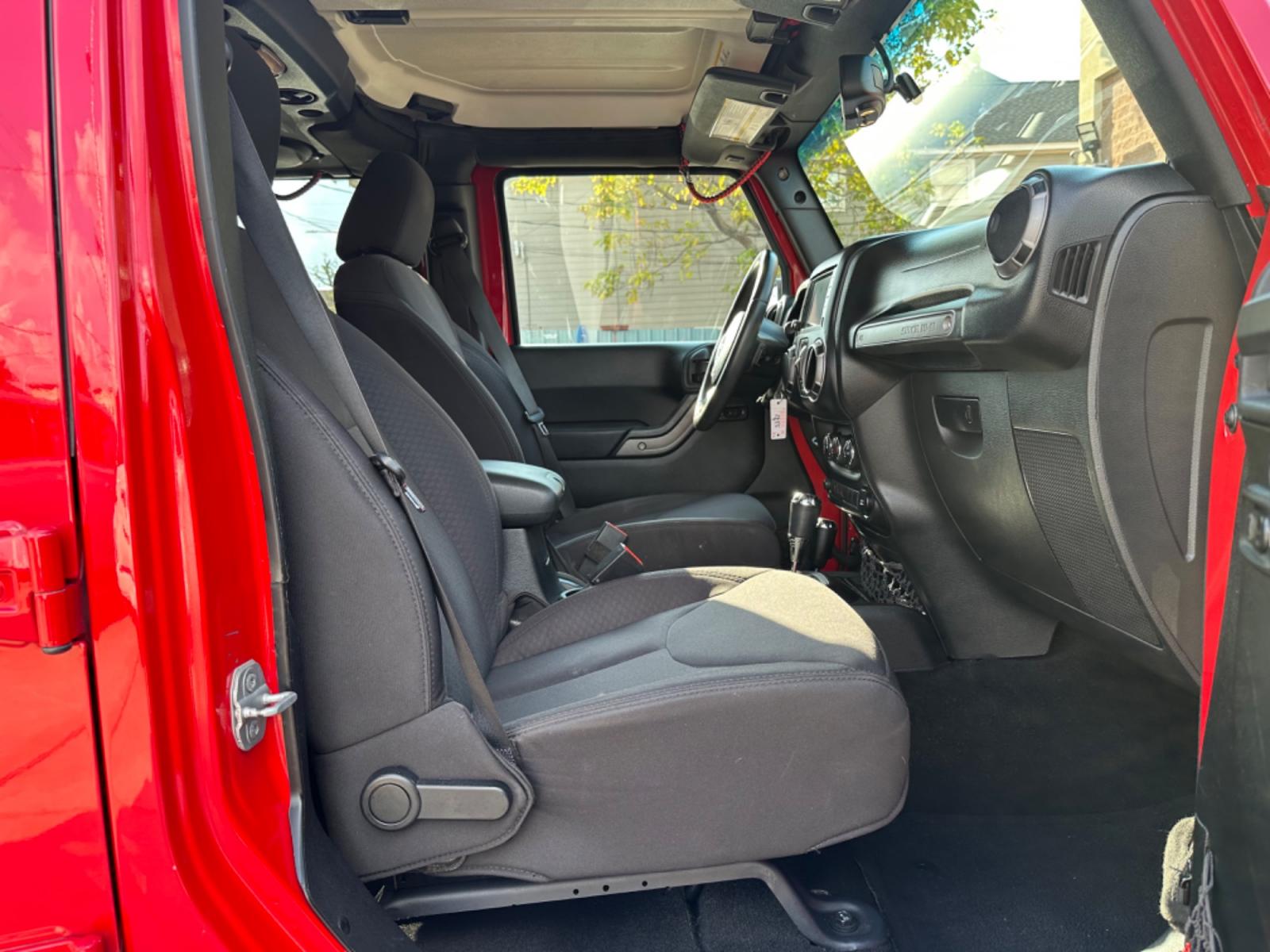 2014 Red /Black Jeep Wrangler Unlimited Sport 4WD (1C4HJWDG7EL) with an 3.6L V6 DOHC 24V FFV engine, Automatic transmission, located at 1501 West 15th St., Houston, 77008, (713) 869-2925, 29.797941, -95.411789 - Photo #4