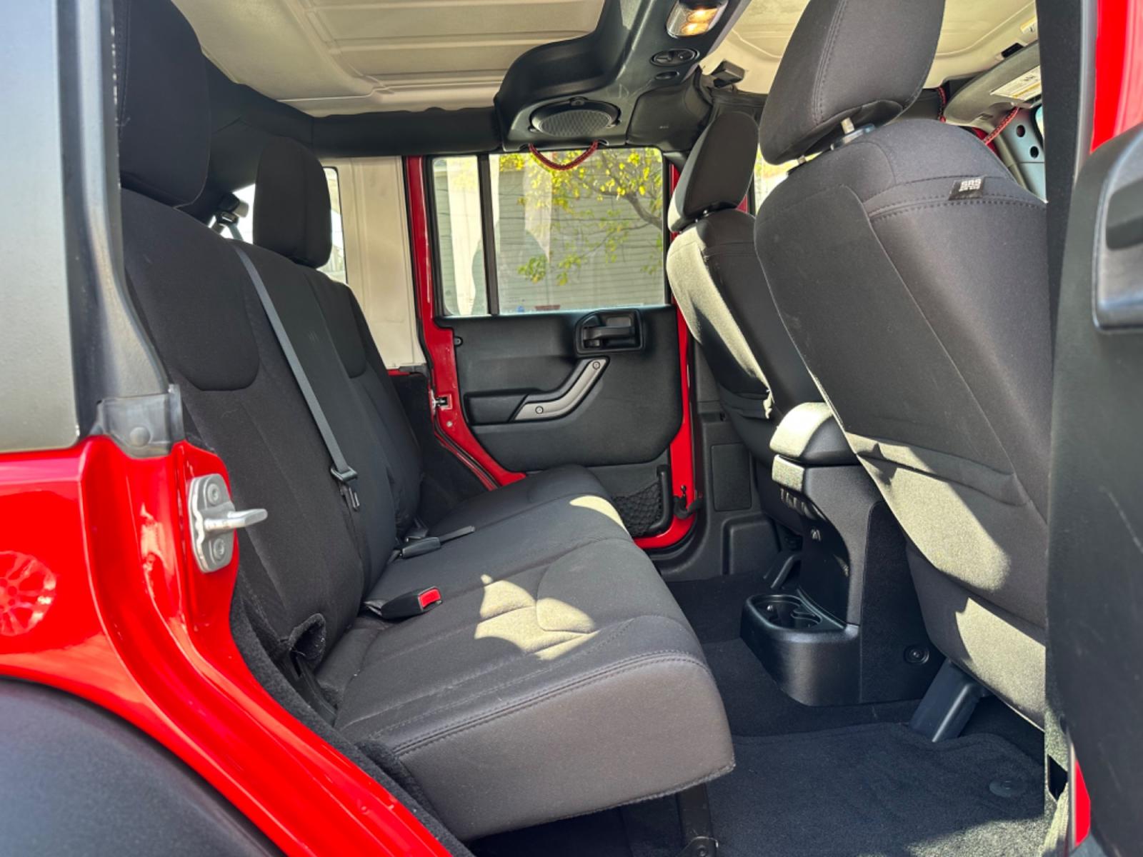 2014 Red /Black Jeep Wrangler Unlimited Sport 4WD (1C4HJWDG7EL) with an 3.6L V6 DOHC 24V FFV engine, Automatic transmission, located at 1501 West 15th St., Houston, 77008, (713) 869-2925, 29.797941, -95.411789 - Photo #5