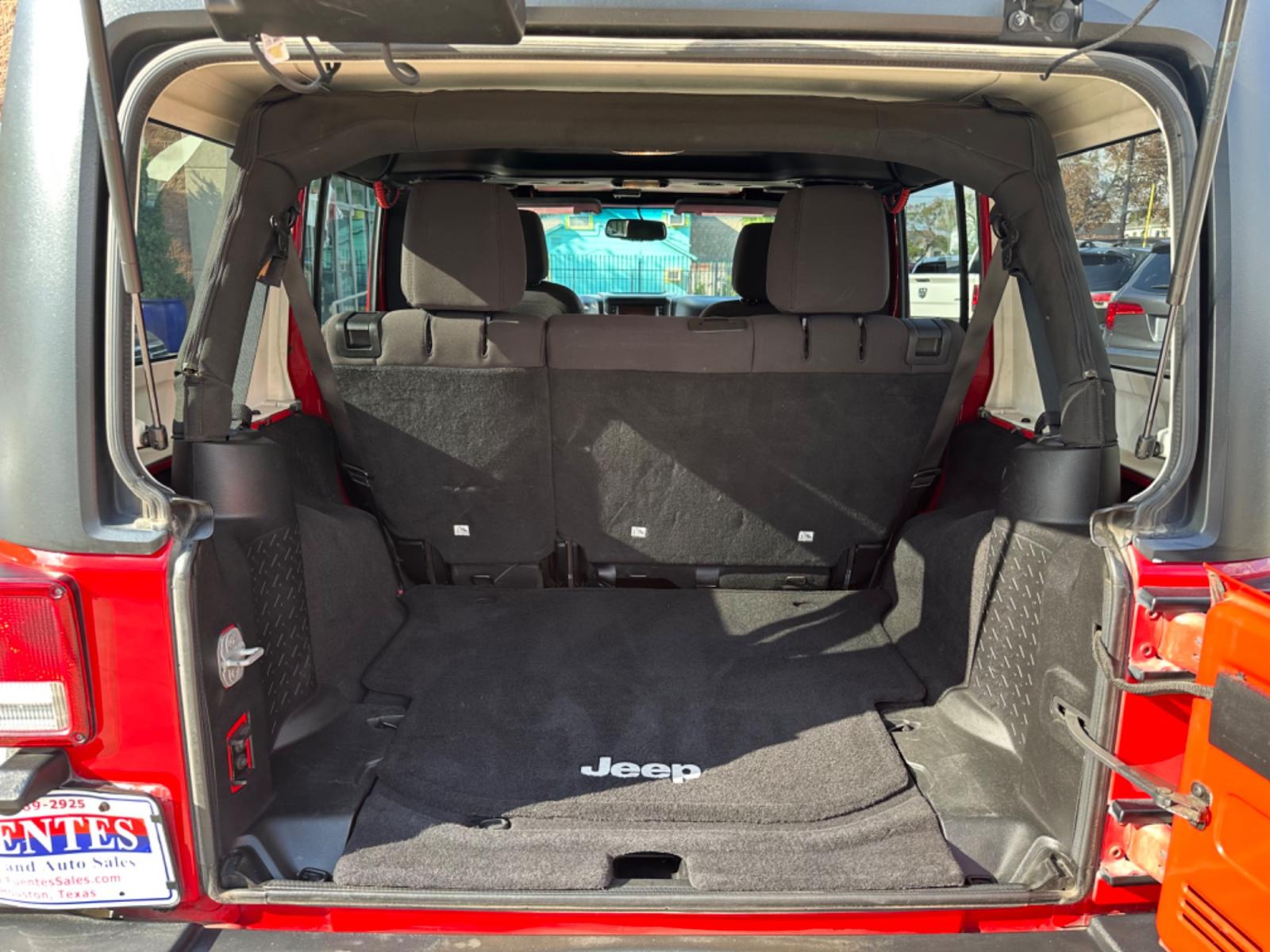 2014 Red /Black Jeep Wrangler Unlimited Sport 4WD (1C4HJWDG7EL) with an 3.6L V6 DOHC 24V FFV engine, Automatic transmission, located at 1501 West 15th St., Houston, 77008, (713) 869-2925, 29.797941, -95.411789 - Photo #6
