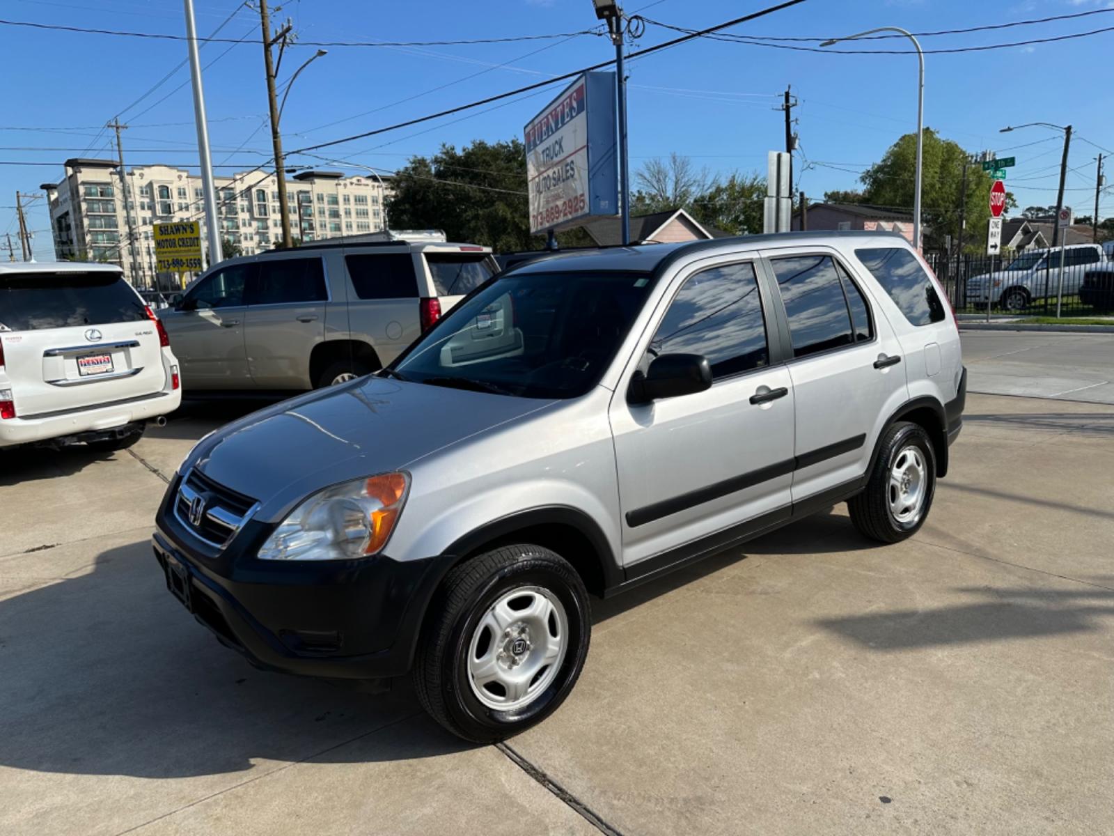2002 Silver /Black Honda CR-V LX 2WD (JHLRD68532C) with an 2.4L L4 DOHC 16V engine, 4-Speed Automatic Overdrive transmission, located at 1501 West 15th St., Houston, 77008, (713) 869-2925, 29.797941, -95.411789 - Photo #0