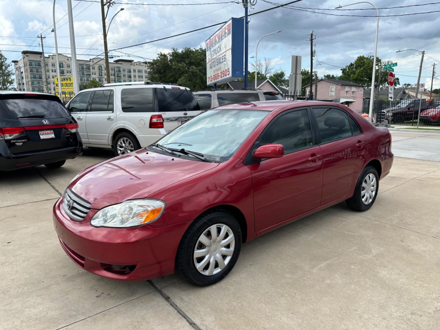 2003 Red /Silver Toyota Corolla CE (1NXBR32E43Z) with an 1.8L L4 DOHC 16V engine, Automatic transmission, located at 1501 West 15th St., Houston, 77008, (713) 869-2925, 29.797941, -95.411789 - Photo#0