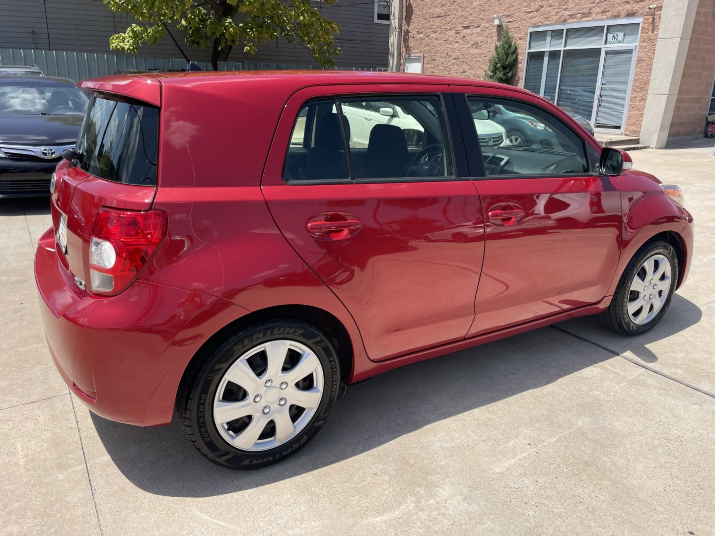 2014 Red /Black Scion xD 5-Door Hatchback 4-Spd AT (JTKKUPB47E1) with an 1.8L L4 DOHC16V engine, 4-Speed Automatic transmission, located at 1501 West 15th St., Houston, 77008, (713) 869-2925, 29.797941, -95.411789- Photo#2