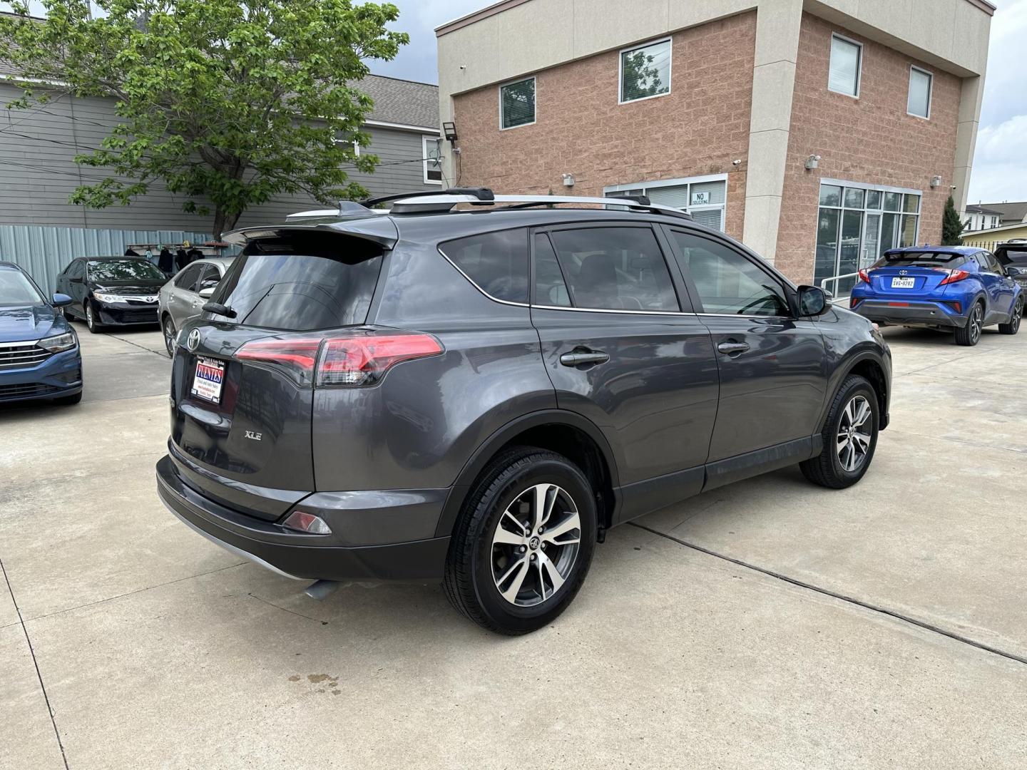 2018 Gray /Black Toyota RAV4 XLE FWD (2T3WFREV6JW) with an 2.5L L4 DOHC 16V engine, 6A transmission, located at 1501 West 15th St., Houston, 77008, (713) 869-2925, 29.797941, -95.411789 - Photo#2