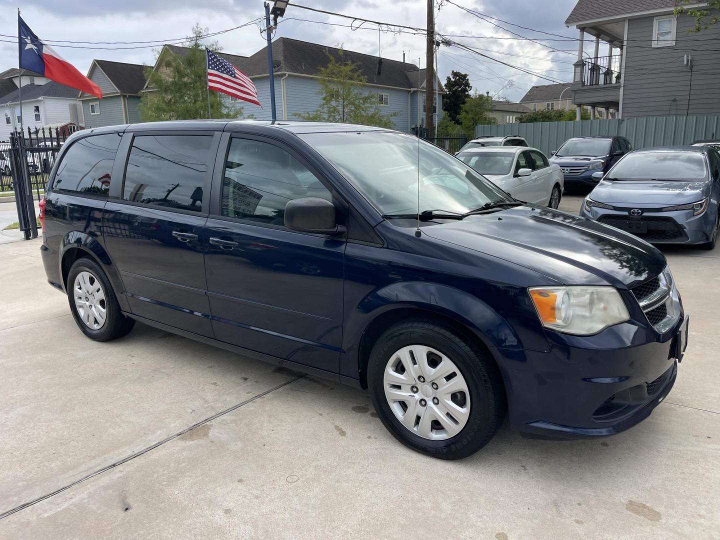 2014 Blue /Black Dodge Grand Caravan SE (2C4RDGBG7ER) with an 3.6L V6 DOHC 24V engine, 6-Speed Automatic transmission, located at 1501 West 15th St., Houston, 77008, (713) 869-2925, 29.797941, -95.411789 - Photo#1