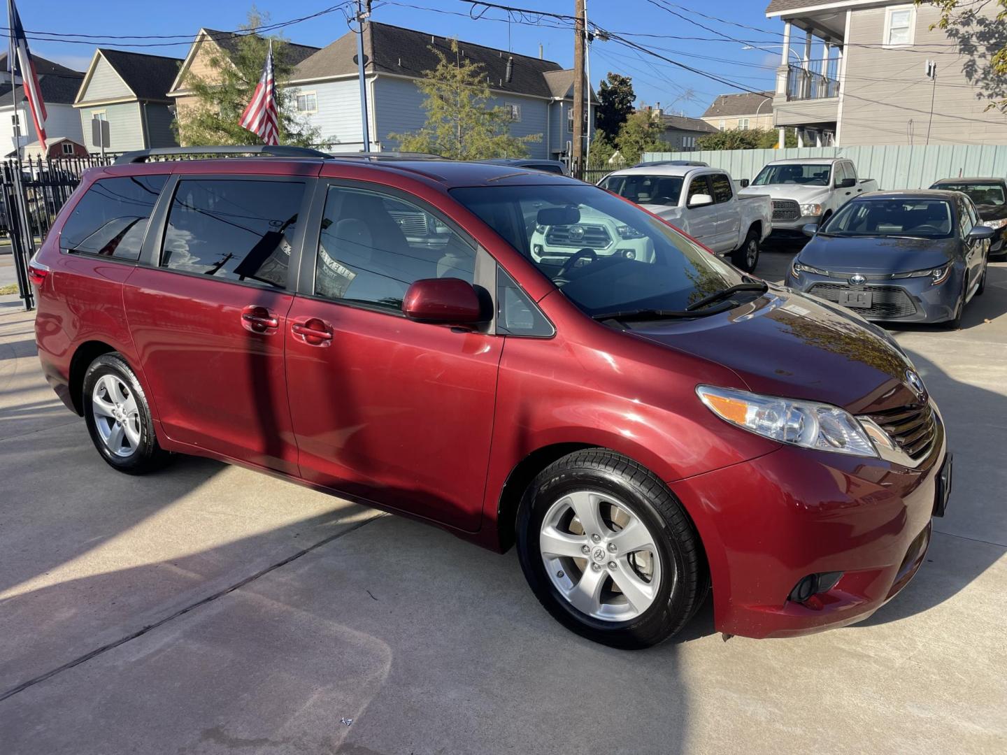 2017 Red /Silver Toyota Sienna LE 8-Passenger (5TDKZ3DC9HS) with an 3.5L V6 EFI DOHC 24V engine, 8A transmission, located at 1501 West 15th St., Houston, 77008, (713) 869-2925, 29.797941, -95.411789 - Photo#1