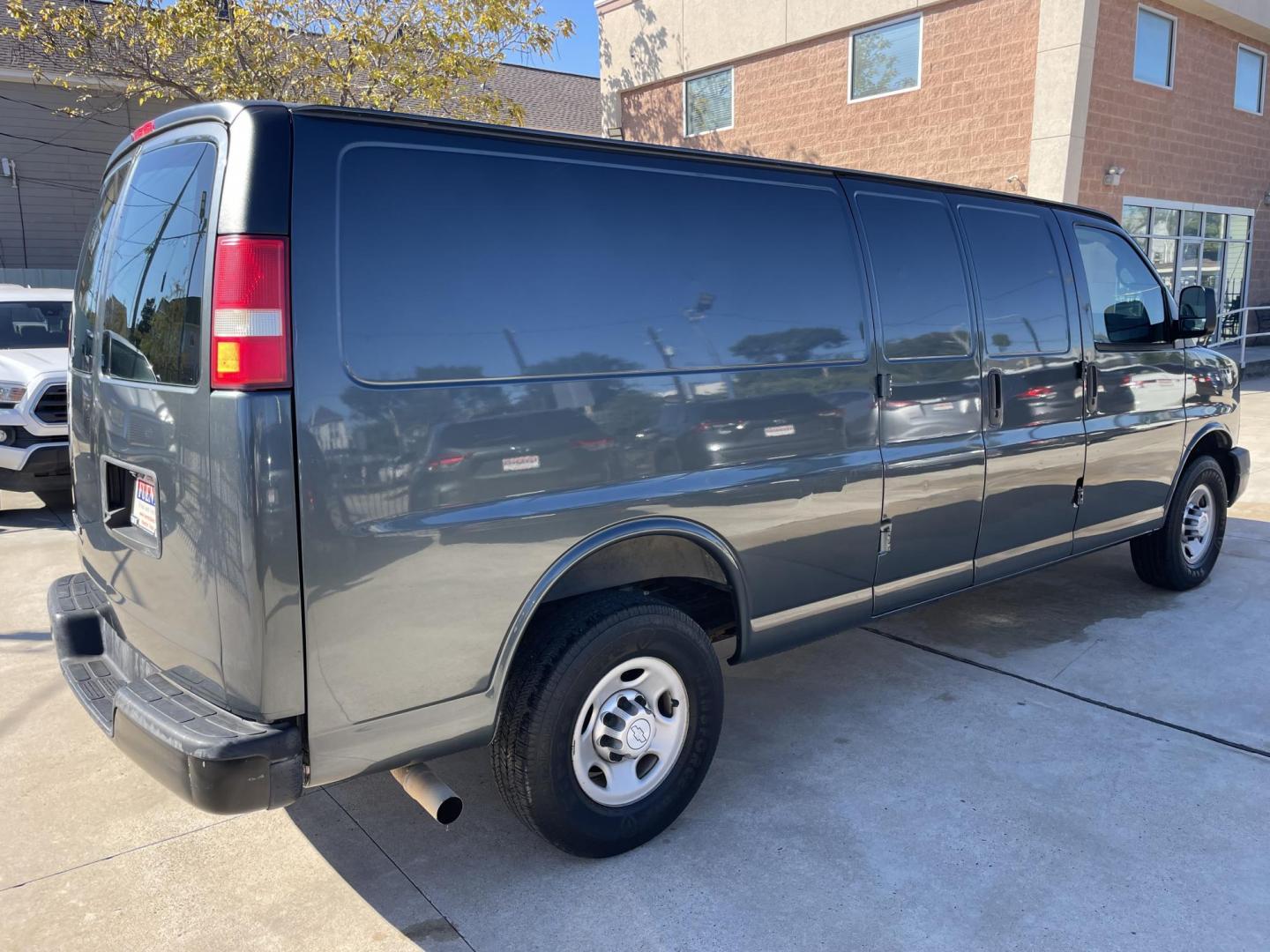 2014 Gray /Silver Chevrolet Express 3500 Cargo Extended (1GCZGUFG0E1) with an 6.0L V8 OHV 16V FFV engine, 6-Speed Automatic transmission, located at 1501 West 15th St., Houston, 77008, (713) 869-2925, 29.797941, -95.411789 - Photo#2