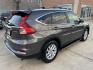 2015 Brown /Black Honda CR-V EX-L 4WD (2HKRM4H72FH) with an 2.4L L4 DOHC 16V engine, Continuously Variable Transmission transmission, located at 1501 West 15th St., Houston, 77008, (713) 869-2925, 29.797941, -95.411789 - Photo#2