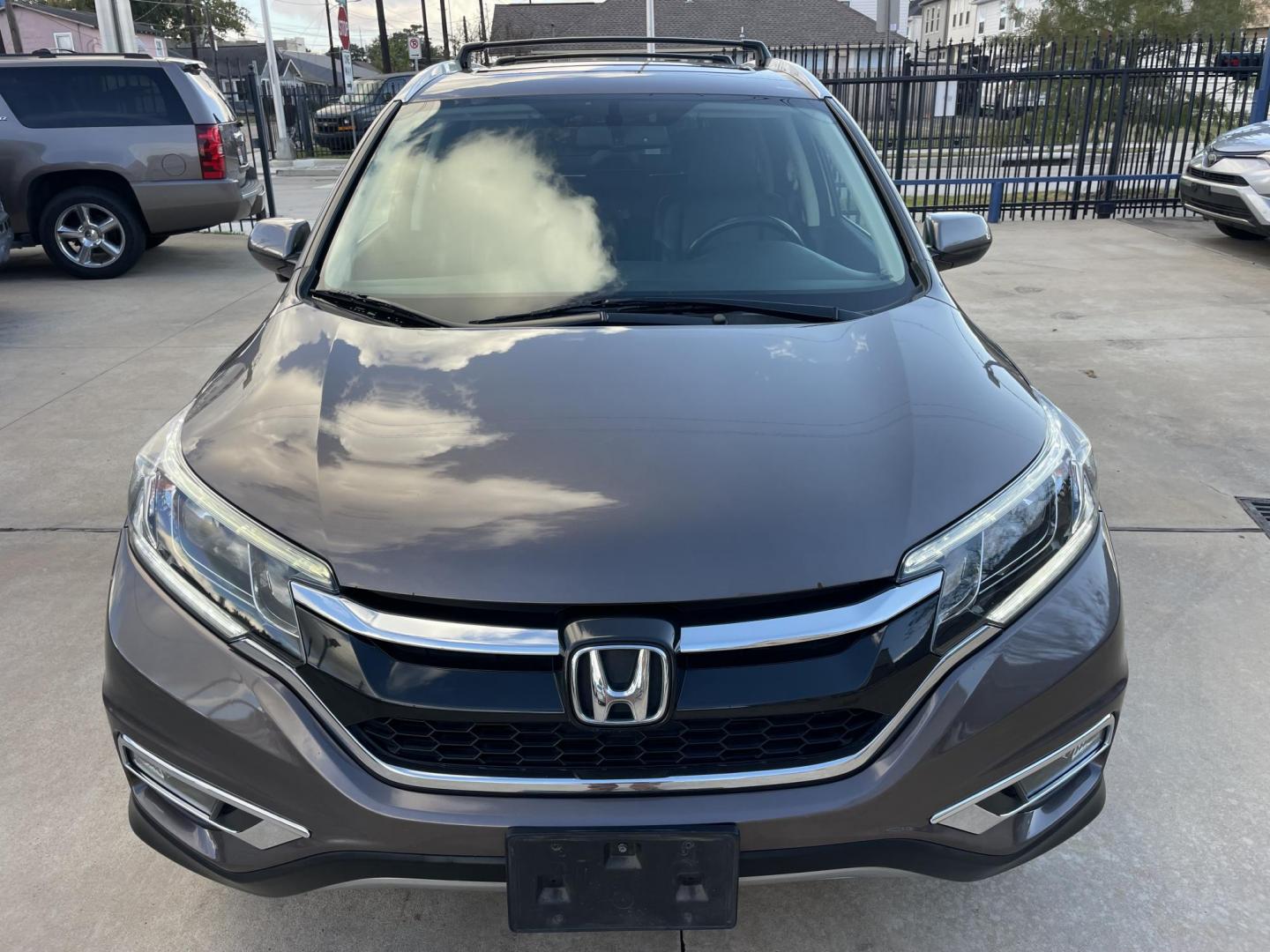 2015 Brown /Black Honda CR-V EX-L 4WD (2HKRM4H72FH) with an 2.4L L4 DOHC 16V engine, Continuously Variable Transmission transmission, located at 1501 West 15th St., Houston, 77008, (713) 869-2925, 29.797941, -95.411789 - Photo#4