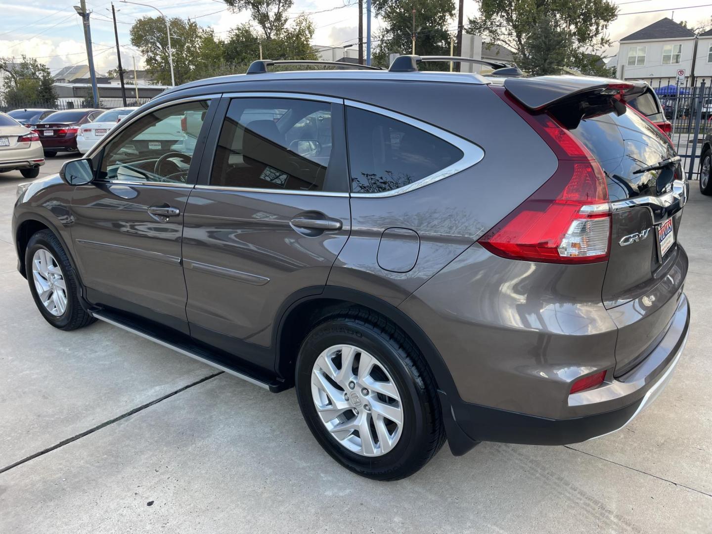 2015 Brown /Black Honda CR-V EX-L 4WD (2HKRM4H72FH) with an 2.4L L4 DOHC 16V engine, Continuously Variable Transmission transmission, located at 1501 West 15th St., Houston, 77008, (713) 869-2925, 29.797941, -95.411789 - Photo#3