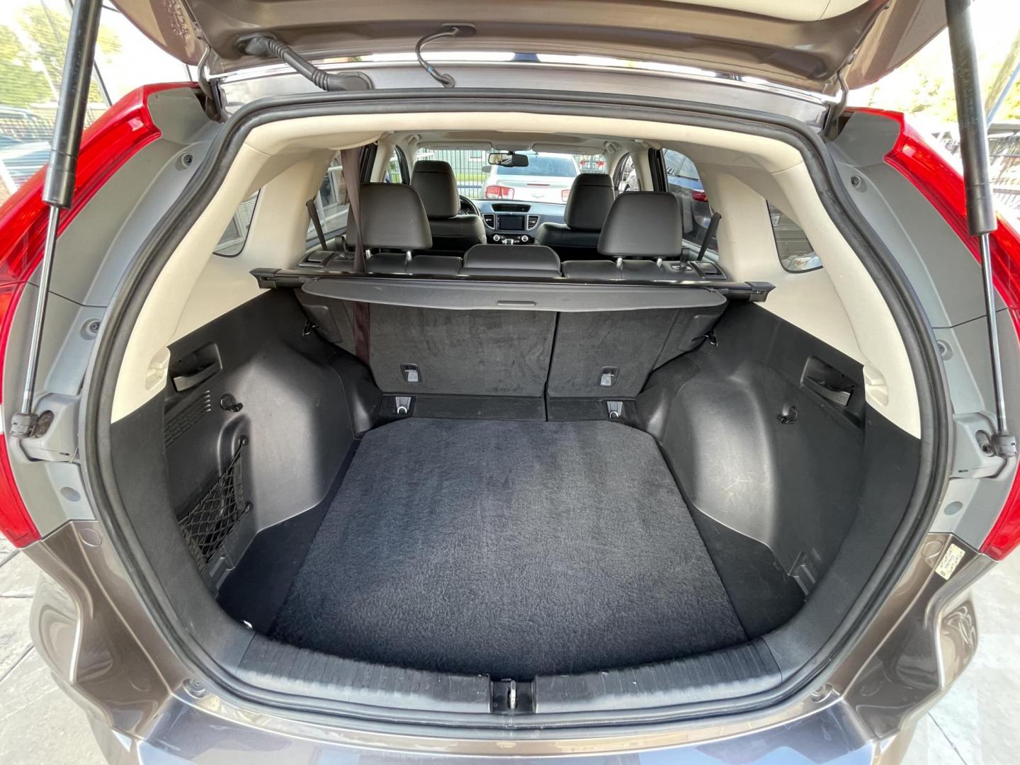 2015 Brown /Black Honda CR-V EX-L 4WD (2HKRM4H72FH) with an 2.4L L4 DOHC 16V engine, Continuously Variable Transmission transmission, located at 1501 West 15th St., Houston, 77008, (713) 869-2925, 29.797941, -95.411789 - Photo#16