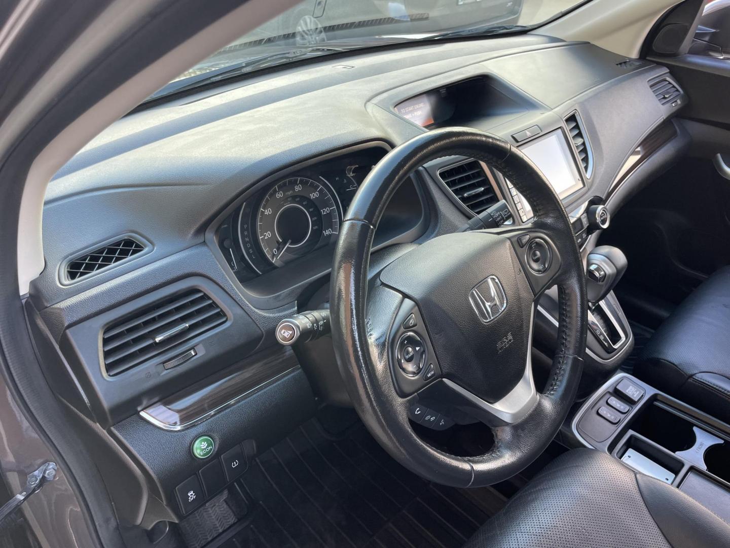 2015 Brown /Black Honda CR-V EX-L 4WD (2HKRM4H72FH) with an 2.4L L4 DOHC 16V engine, Continuously Variable Transmission transmission, located at 1501 West 15th St., Houston, 77008, (713) 869-2925, 29.797941, -95.411789 - Photo#20