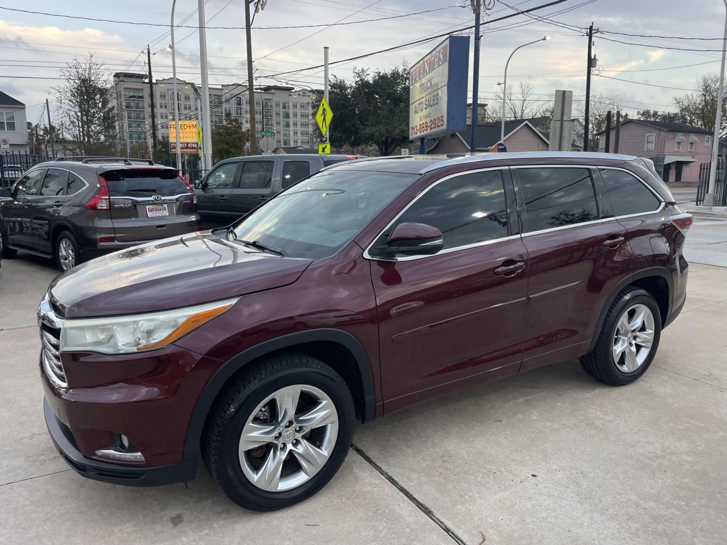 2015 Burgundy /Black Toyota Highlander Limited FWD V6 (5TDYKRFH9FS) with an 3.5L V6 DOHC 24V engine, 6-Speed Automatic transmission, located at 1501 West 15th St., Houston, 77008, (713) 869-2925, 29.797941, -95.411789 - Photo#0