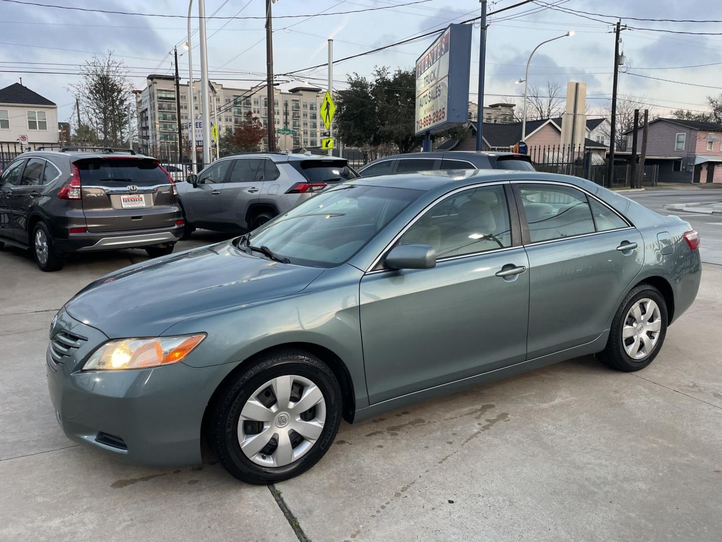 2009 Green /Beige Toyota Camry CE 5-Spd AT (4T4BE46K99R) with an 2.4L L4 DOHC 16V engine, 5-Speed Automatic Overdrive transmission, located at 1501 West 15th St., Houston, 77008, (713) 869-2925, 29.797941, -95.411789 - Photo#0
