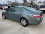 2009 Green /Beige Toyota Camry CE 5-Spd AT (4T4BE46K99R) with an 2.4L L4 DOHC 16V engine, 5-Speed Automatic Overdrive transmission, located at 1501 West 15th St., Houston, 77008, (713) 869-2925, 29.797941, -95.411789 - Photo#3