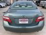 2009 Green /Beige Toyota Camry CE 5-Spd AT (4T4BE46K99R) with an 2.4L L4 DOHC 16V engine, 5-Speed Automatic Overdrive transmission, located at 1501 West 15th St., Houston, 77008, (713) 869-2925, 29.797941, -95.411789 - Photo#5