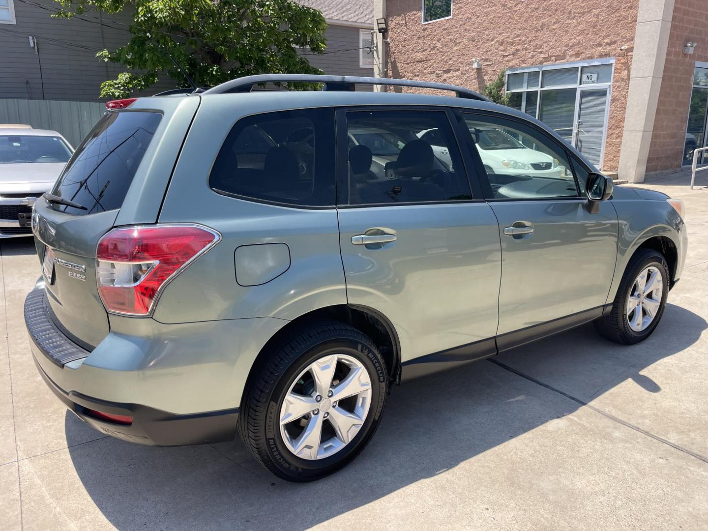 2014 Green /Silver Subaru Forester 2.5i Premium (JF2SJADC7EH) with an 2.5L H4 SOHC 16V engine, 6-Speed Automatic transmission, located at 1501 West 15th St., Houston, 77008, (713) 869-2925, 29.797941, -95.411789 - Photo#2