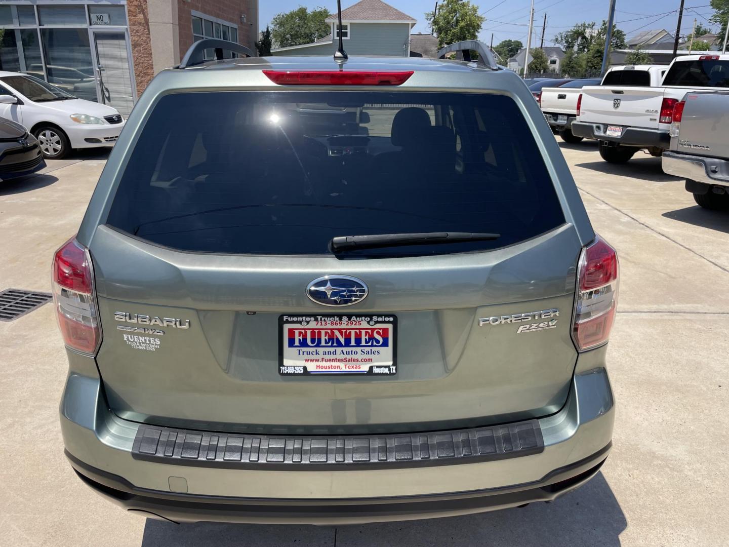 2014 Green /Silver Subaru Forester 2.5i Premium (JF2SJADC7EH) with an 2.5L H4 SOHC 16V engine, 6-Speed Automatic transmission, located at 1501 West 15th St., Houston, 77008, (713) 869-2925, 29.797941, -95.411789 - Photo#3