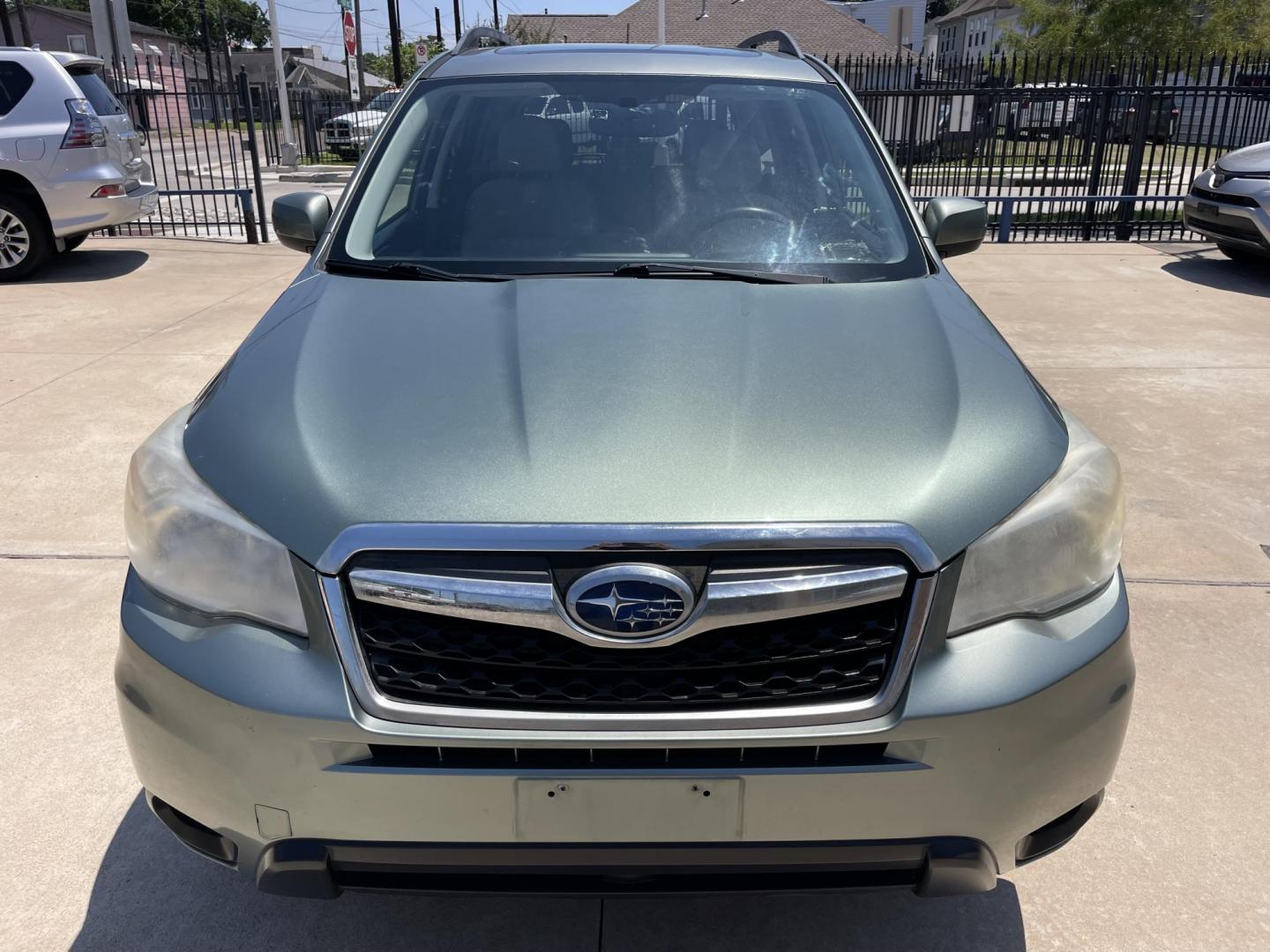 2014 Green /Silver Subaru Forester 2.5i Premium (JF2SJADC7EH) with an 2.5L H4 SOHC 16V engine, 6-Speed Automatic transmission, located at 1501 West 15th St., Houston, 77008, (713) 869-2925, 29.797941, -95.411789 - Photo#4