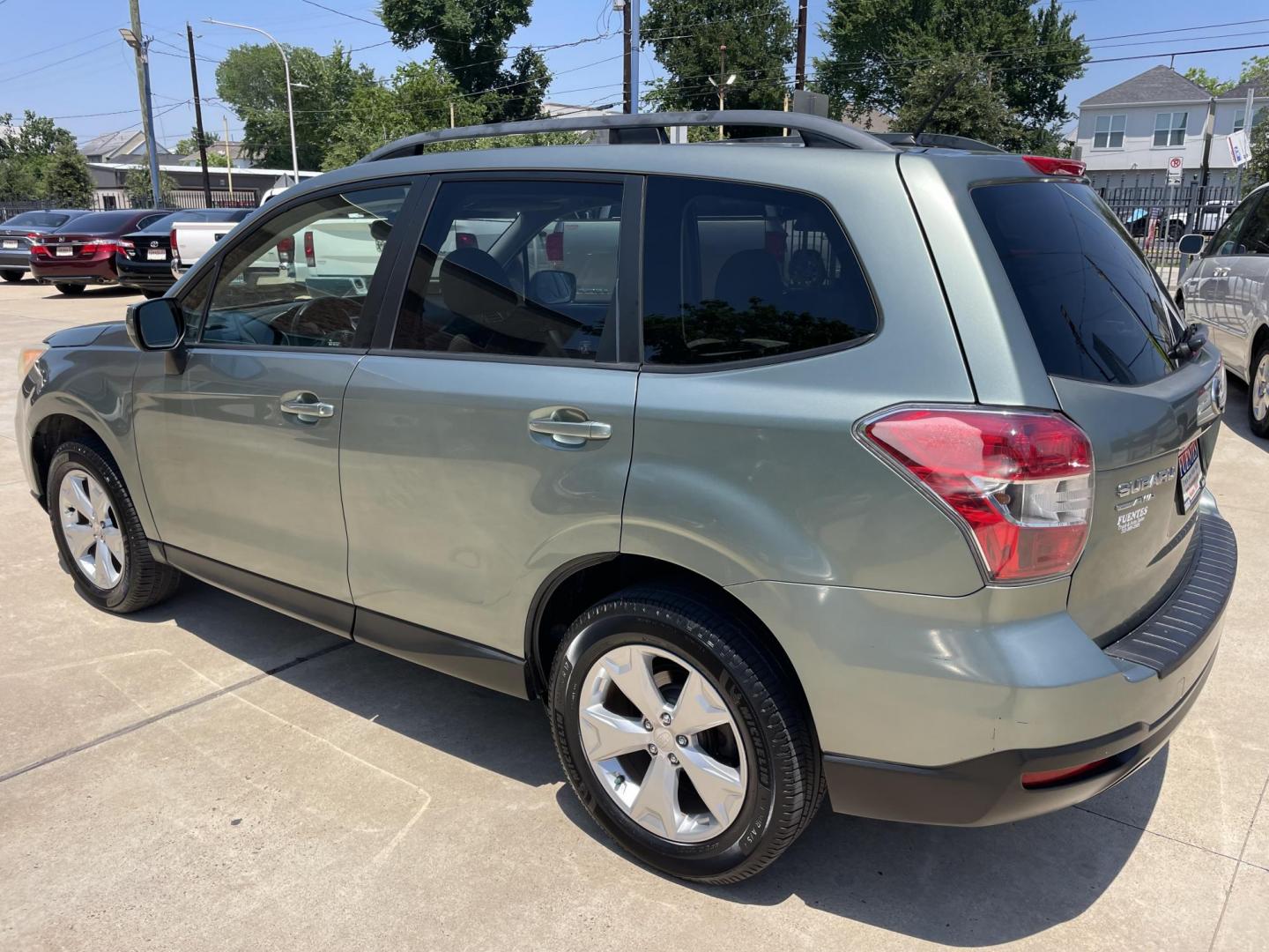 2014 Green /Silver Subaru Forester 2.5i Premium (JF2SJADC7EH) with an 2.5L H4 SOHC 16V engine, 6-Speed Automatic transmission, located at 1501 West 15th St., Houston, 77008, (713) 869-2925, 29.797941, -95.411789 - Photo#5