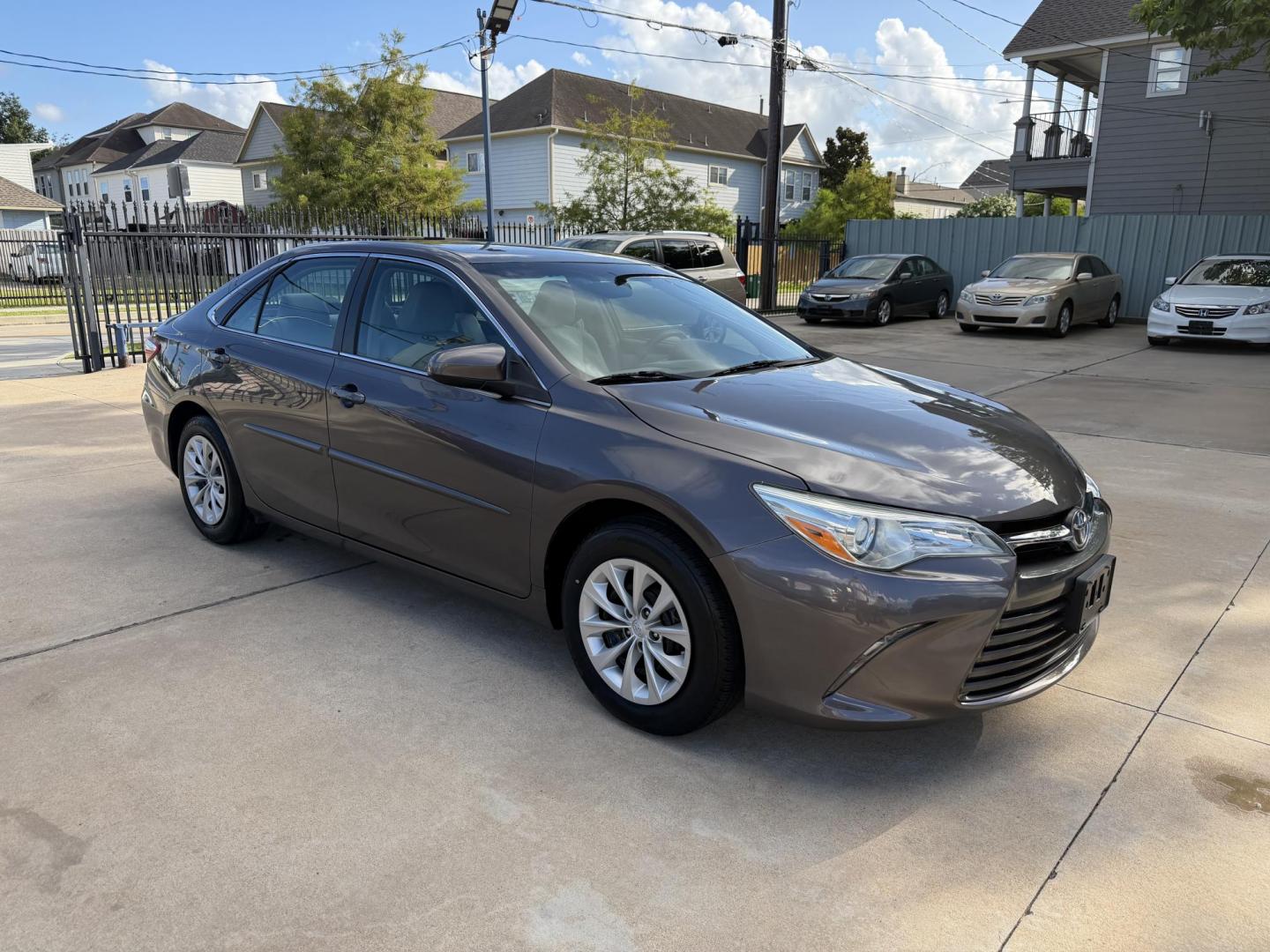 2015 Gray /Gray Toyota Camry LE (4T1BF1FK7FU) with an 2.5L L4 DOHC 16V engine, 6-Speed Automatic transmission, located at 1501 West 15th St., Houston, 77008, (713) 869-2925, 29.797941, -95.411789 - Photo#1