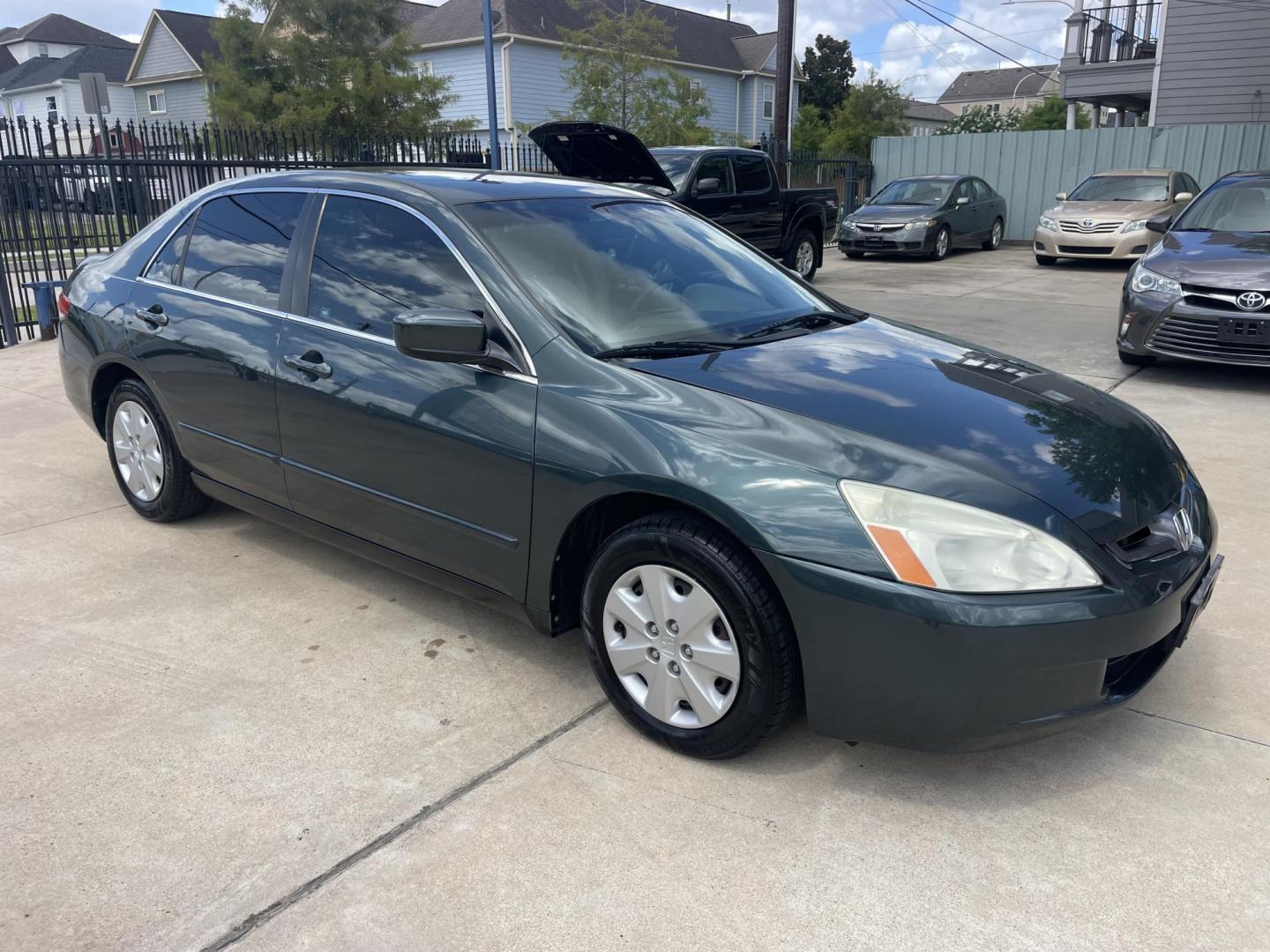2004 Green /Beige Honda Accord LX sedan AT (3HGCM56384G) with an 2.4L L4 DOHC 16V engine, 5-Speed Automatic Overdrive transmission, located at 1501 West 15th St., Houston, 77008, (713) 869-2925, 29.797941, -95.411789 - Photo#1