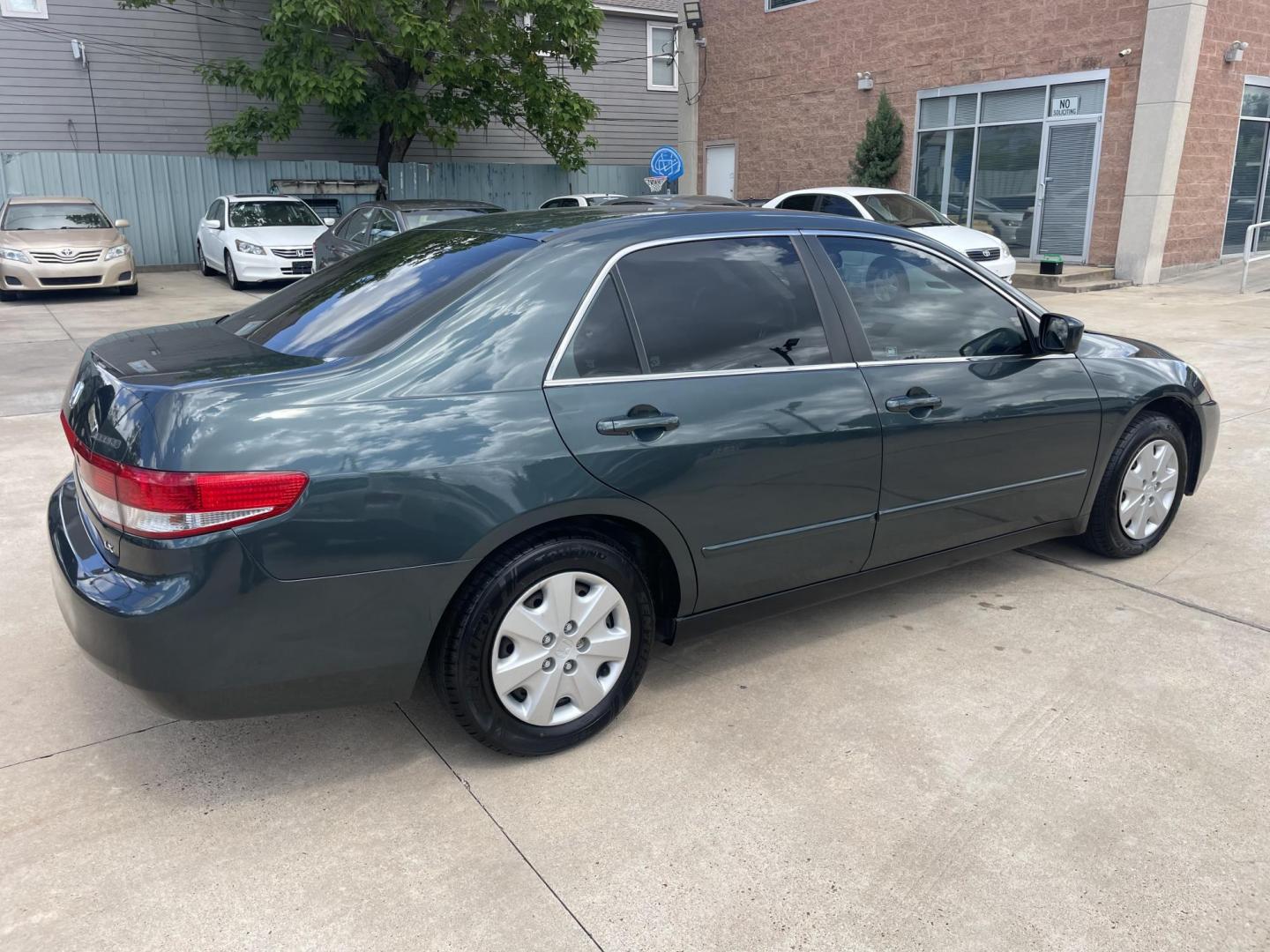 2004 Green /Beige Honda Accord LX sedan AT (3HGCM56384G) with an 2.4L L4 DOHC 16V engine, 5-Speed Automatic Overdrive transmission, located at 1501 West 15th St., Houston, 77008, (713) 869-2925, 29.797941, -95.411789 - Photo#2