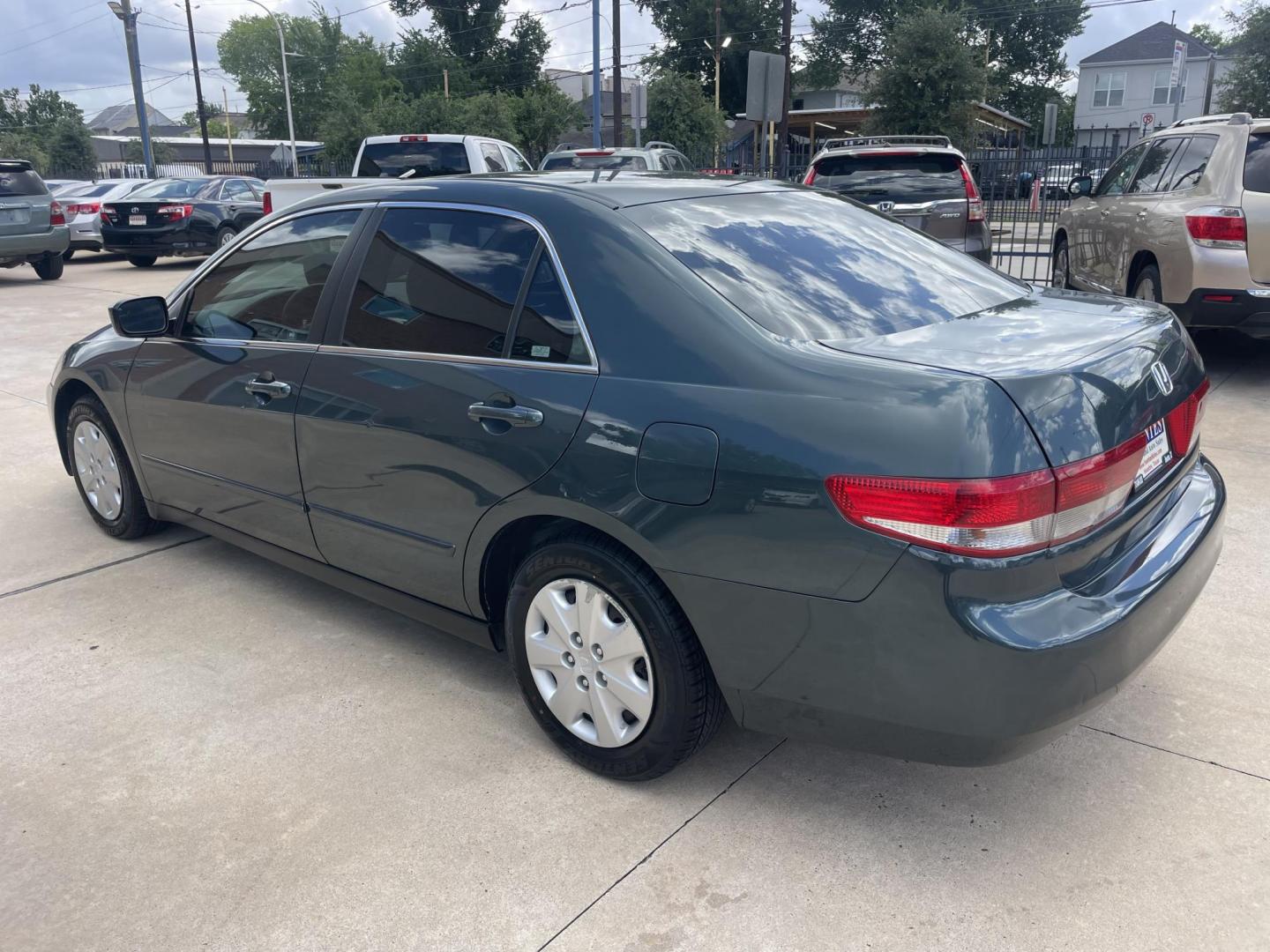 2004 Green /Beige Honda Accord LX sedan AT (3HGCM56384G) with an 2.4L L4 DOHC 16V engine, 5-Speed Automatic Overdrive transmission, located at 1501 West 15th St., Houston, 77008, (713) 869-2925, 29.797941, -95.411789 - Photo#3