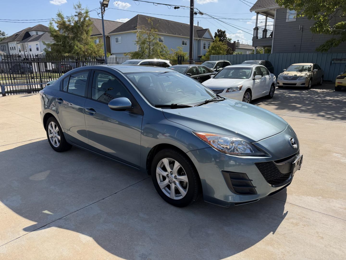 2010 Blue /Black Mazda MAZDA3 (JM1BL1SF6A1) with an 2.0 engine, Manual transmission, located at 1501 West 15th St., Houston, 77008, (713) 869-2925, 29.797941, -95.411789- Photo#2
