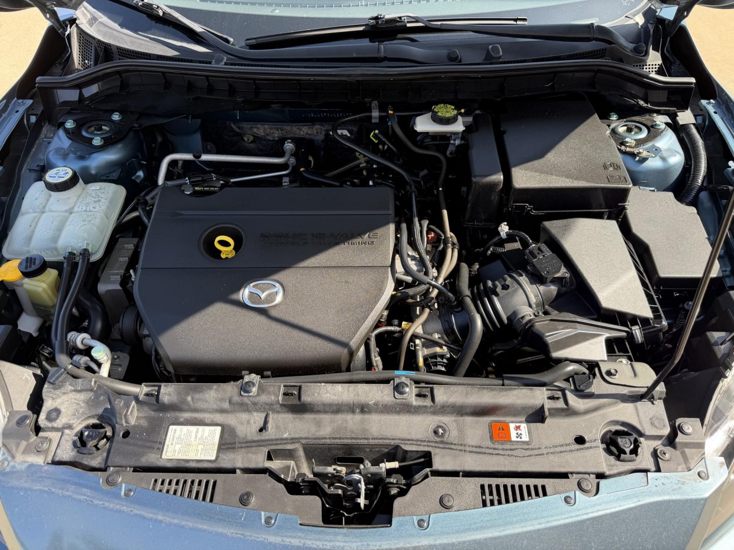 2010 Blue /Black Mazda MAZDA3 (JM1BL1SF6A1) with an 2.0 engine, Manual transmission, located at 1501 West 15th St., Houston, 77008, (713) 869-2925, 29.797941, -95.411789- Photo#14