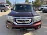 2009 Maroon /Black Honda Pilot EX-L 4WD (5FNYF48569B) with an 3.5L V6 SOHC 24V engine, 5A transmission, located at 1501 West 15th St., Houston, 77008, (713) 869-2925, 29.797941, -95.411789- Photo#1