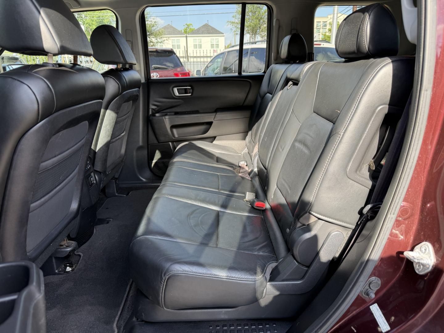 2009 Maroon /Black Honda Pilot EX-L 4WD (5FNYF48569B) with an 3.5L V6 SOHC 24V engine, 5A transmission, located at 1501 West 15th St., Houston, 77008, (713) 869-2925, 29.797941, -95.411789- Photo#10