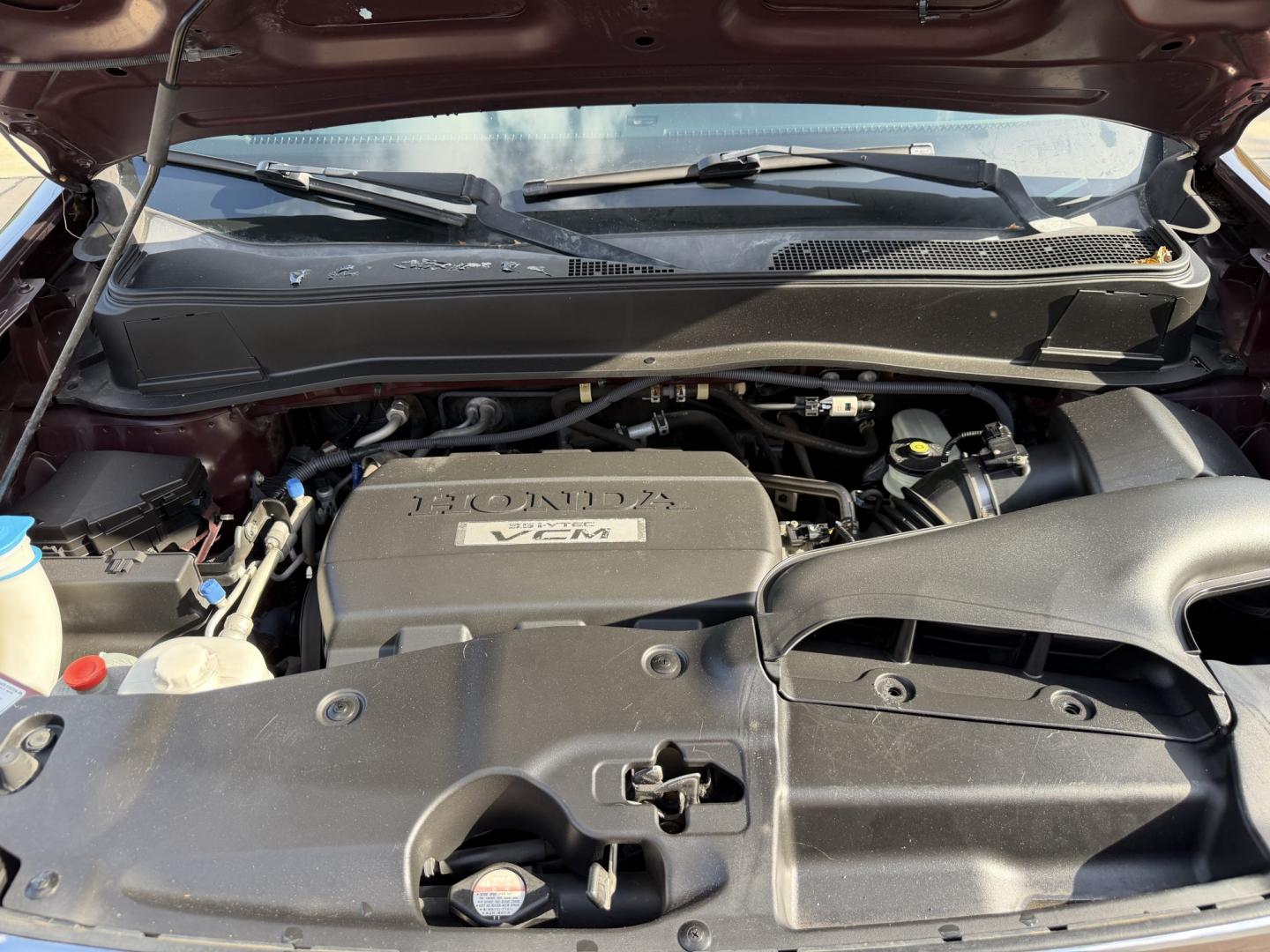 2009 Maroon /Black Honda Pilot EX-L 4WD (5FNYF48569B) with an 3.5L V6 SOHC 24V engine, 5A transmission, located at 1501 West 15th St., Houston, 77008, (713) 869-2925, 29.797941, -95.411789- Photo#17