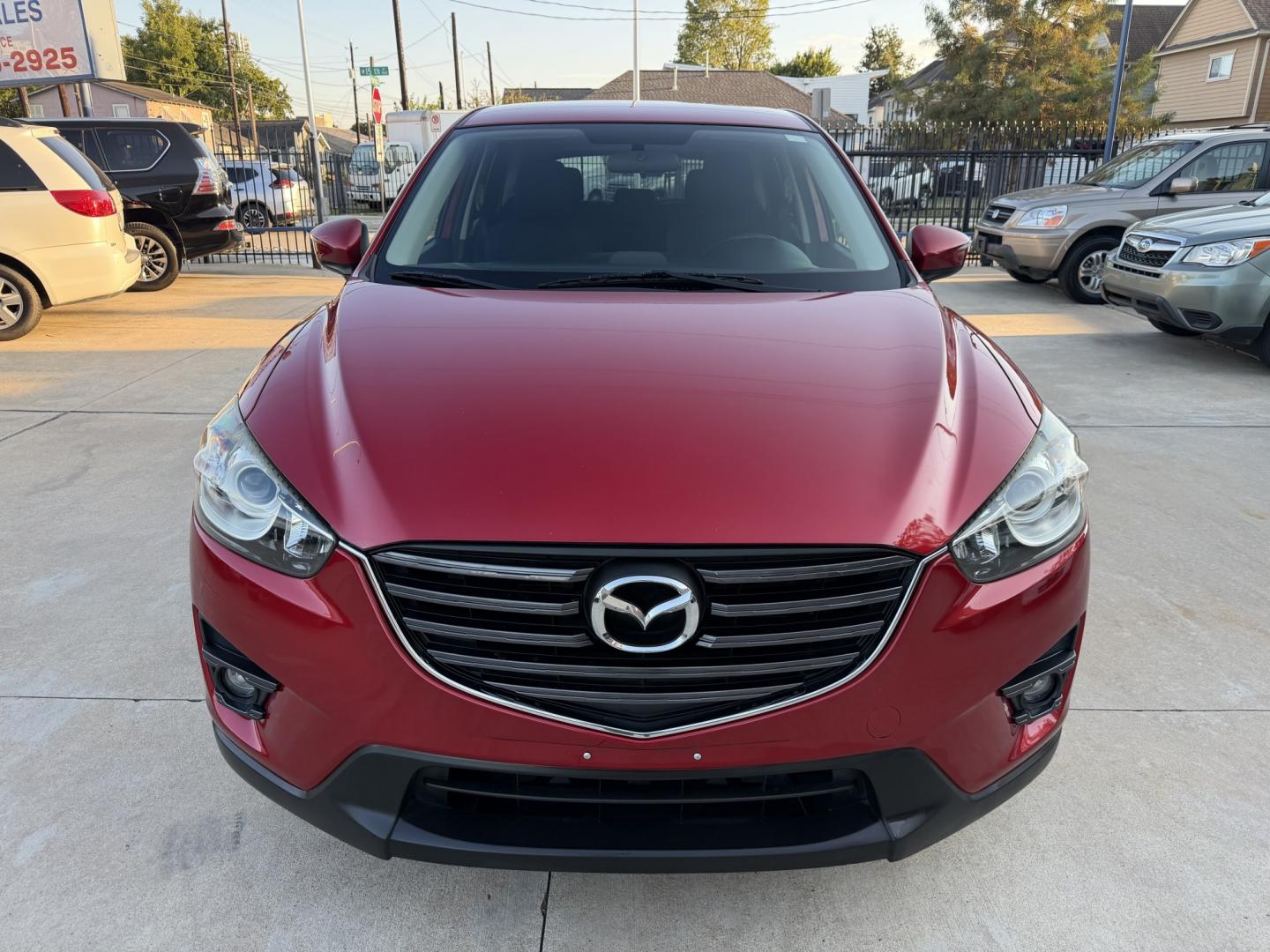 2016 Red /Black Mazda CX-5 Touring (JM3KE2CY5G0) with an 2.5L L4 DOHC 16V engine, 6A transmission, located at 1501 West 15th St., Houston, 77008, (713) 869-2925, 29.797941, -95.411789- Photo#1
